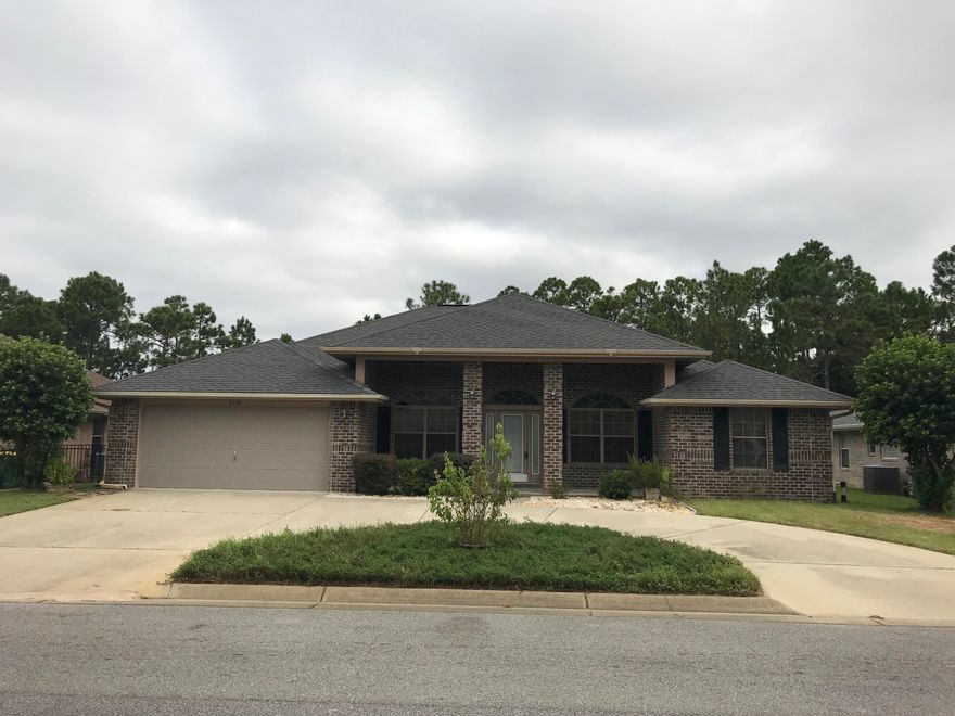 With its grand covered front entrance, this split floor plan 4 bedroom 2 bathroom home is both warm and inviting. Enter, and the spacious living area, with vaulted ceiling and plant ledges is casual and open to the kitchen and eat-in dining areas. The kitchen includes all stainless steel appliances, a pantry and plenty of cabinets for storage. The home also features a formal dining room and office. The master bedroom suite is spacious with plenty of light, as well as private access to the screened in back patio. The master bathroom has double vanities, a stand alone shower, as well as a spacious walk-in closet. The separate garden tub has an accent glass block window that includes a custom shade for