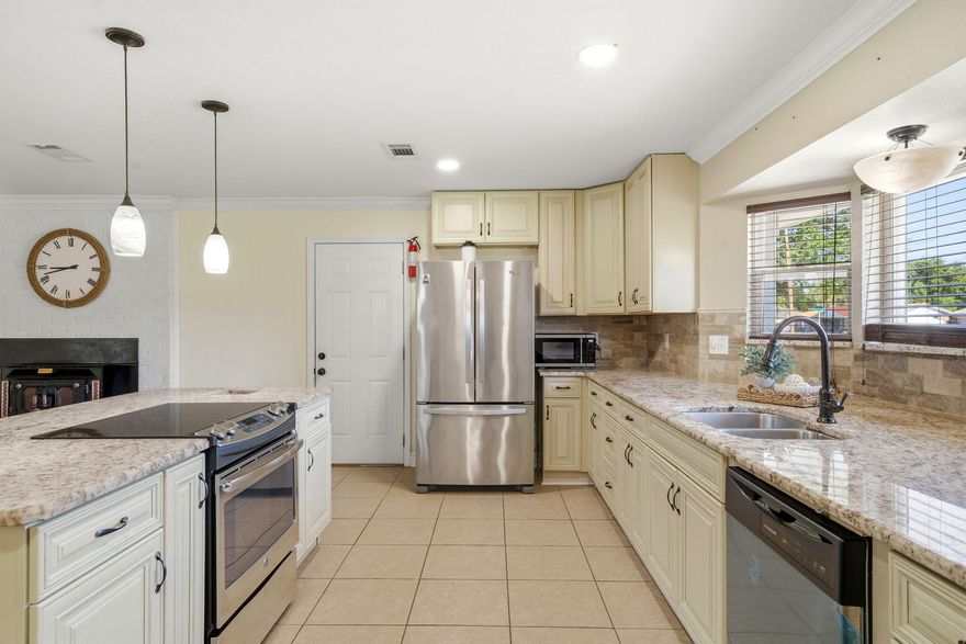 Welcome to a beautifully maintained corner-lot home that blends space, function, and location--just 10 minutes from the beach and close to everything town has to offer.Set on a huge half-acre lot, this property is not in a flood zone, has no HOA, and offers the freedom and flexibility today's buyers are searching for. The exterior features a durable metal roof, vinyl siding with brick accents, full fencing, and a double gate for easy access to the backyard--perfect for boats, trailers, or future projects. Inside, you'll appreciate the open floor plan and the comfort of no carpet throughout. The kitchen is designed for both everyday living and entertaining, featuring soft-closing cabinets, an abundance of storage, a central island with a flat-top GE stove, Whirlpool refrigerator, and Frigidaire dishwasherall thoughtfully laid out for convenience and flow.

The primary suite offers a large, spacious walk-in closet complete with custom built-ins (no wire shelving) and direct access to the deep laundry room, which includes front-loaders and extensive cabinetryfunctionality at its finest. Bedrooms are located on the same side of the home, creating a traditional layout ideal for families.

A unique architectural touch leads you down into the living area/loft with a soft, comfortable step-down flooring, adding character and warmth to the space. Accordion-style semi-transparent blinds provide natural light while maintaining privacy.

Outside is where this property truly shines. With two rear exits, extra concrete, and easy side-yard access, the backyard is already prepped for a brand-new pooland a pool company can access the yard with ease. There's also an oversized, tall metal barn cover ideal for an RV, boat, or recreational toys.

Additional highlights include a single-car garage, water heater and clean, clearly labeled breaker panel in the garage, minimal guttering, and busy-road access that offers convenience to nearby amenities.

Currently used and meticulously cared for as an Airbnb, this home is move-in ready and equally well-suited for a primary residence or investment opportunity.

Space, freedom, and locationthis one checks boxes that are hard to find.