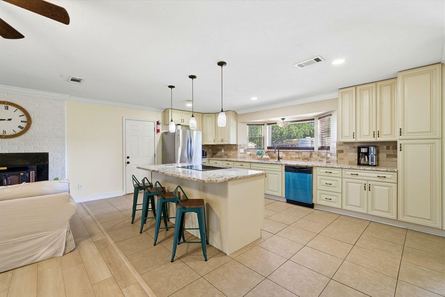 Welcome to a beautifully maintained corner-lot home that blends space, function, and location--just 10 minutes from the beach and close to everything town has to offer.Set on a huge half-acre lot, this property is not in a flood zone, has no HOA, and offers the freedom and flexibility today's buyers are searching for. The exterior features a durable metal roof, vinyl siding with brick accents, full fencing, and a double gate for easy access to the backyard--perfect for boats, trailers, or future projects. Inside, you'll appreciate the open floor plan and the comfort of no carpet throughout. The kitchen is designed for both everyday living and entertaining, featuring soft-closing cabinets, an abundance of storage, a central island with a flat-top GE stove, Whirlpool refrigerator, and Frigidaire dishwasherall thoughtfully laid out for convenience and flow.

The primary suite offers a large, spacious walk-in closet complete with custom built-ins (no wire shelving) and direct access to the deep laundry room, which includes front-loaders and extensive cabinetryfunctionality at its finest. Bedrooms are located on the same side of the home, creating a traditional layout ideal for families.

A unique architectural touch leads you down into the living area/loft with a soft, comfortable step-down flooring, adding character and warmth to the space. Accordion-style semi-transparent blinds provide natural light while maintaining privacy.

Outside is where this property truly shines. With two rear exits, extra concrete, and easy side-yard access, the backyard is already prepped for a brand-new pooland a pool company can access the yard with ease. There's also an oversized, tall metal barn cover ideal for an RV, boat, or recreational toys.

Additional highlights include a single-car garage, water heater and clean, clearly labeled breaker panel in the garage, minimal guttering, and busy-road access that offers convenience to nearby amenities.

Currently used and meticulously cared for as an Airbnb, this home is move-in ready and equally well-suited for a primary residence or investment opportunity.

Space, freedom, and locationthis one checks boxes that are hard to find.