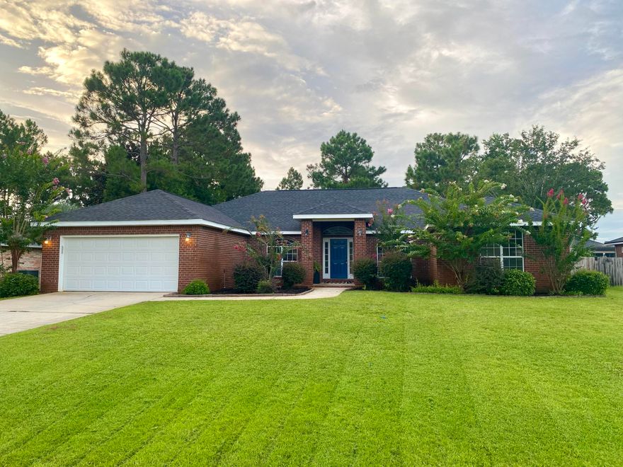 $10,000 towards buyers closing assistance!!! Nestled within the sought-after Holley By The Sea neighborhood, this stunning all-brick residence boasts an expansive open floor plan with desirable amenities. Highlights include new LVP flooring throughout, vaulted ceilings, plant ledges, and distinct formal living and dining areas. The airy eat-in kitchen showcases a built-in workstation and a central island with a breakfast bar.  The split bedroom layout offers three additional bedrooms alongside a generous master suite retreat. The master en suite features a jacuzzi garden tub, dual marble vanities, a separate shower, and ample storage with two walk-in closets.