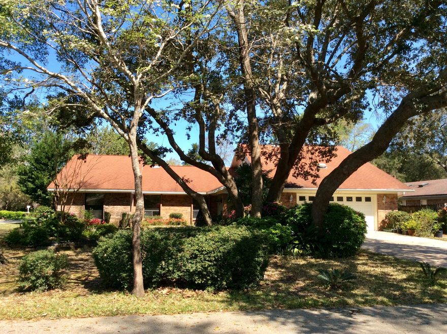 This spacious 5-bedroom 4 full bath home is on a large corner lot in a picturesque setting complete with mature oak trees and landscaping. It is located in the sought-after neighborhood of Kenwood, within walking distance to the school. The kitchen has an oversized island and lots of cabinets and storage. Kitchen is open to a dining area with an additional formal dining room. Plenty of room to entertain! Two spacious living areas, den has a wonderful gas brick fireplace and lots of natural light. This home has two master suites, one with a large tiled walk in shower,(maybe handicap accessible). Laundry room has extra shelving for storage. There is a bonus room upstairs with a full bath that can be a 5th bedroom, craft room, play area, the possibilities are endless! Yard building ''as is''