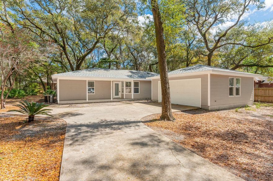 This beautiful 3-bedroom, 2-bath home in the desirable Waterview Cove neighborhood offers 1,616 sq. ft. of comfortable living space. Featuring an open floor plan, a spacious kitchen with ample cabinetry, and a cozy living area, this home is perfect for those seeking peace and convenience. The primary suite includes a private bath, while the additional bedrooms provide plenty of space. Situated on a large 0.35-acre lot with mature shade trees, this property also includes a detached garage for extra storage. Waterview Cove residents enjoy access to a private community kayak launch, making it easy to explore the nearby waterways. Enjoy the quiet surroundings and Beautiful sunset views! Tenants may not use the fire place.  NO PET