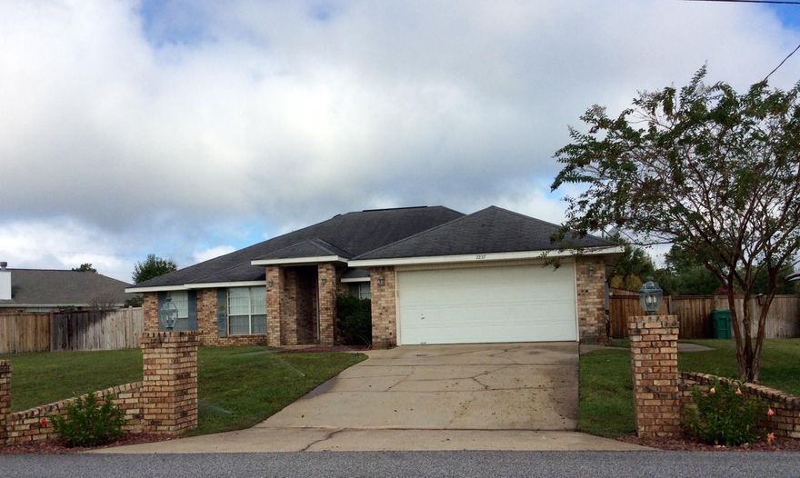 The perfect South Crestview Location on a FLAT LOT offering quick commute to Eglin AFB, Duke Field, Hurlburt, and 7th Special Forces, located next door to Foxwood Country Club and Golf Course! This well maintained all brick 4 bedroom 2 full bath home with wood burning fireplace, outdoor patio with fire pit, a 6 x 20 workshop/shed with brick paver surround, a large fenced yard with RV/Boat storage area!The entry features tiled floors that extend into office & formal dining room that flank each side. The office boasts beautiful built in desk and floor to ceiling solid wood bookcases. The living room is oversized features vaulted ceiling,corner fireplace, and built in display ledge! The HUGE kitchen has tons of cabinetry and counter space, stainless steel appliances, breakfast bar, breakfast