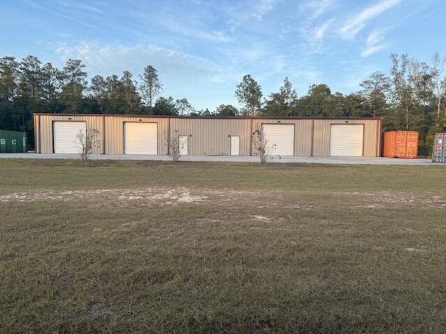 This 5,000 SF pre-engineered metal warehouse, built in 2018, sits on 5.56 acres in a well-maintained and partially cleared lot. Constructed with a steel frame, metal exterior walls, and a metal roof, the building is designed for durability and functionality and has been kept in great condition! The concrete-finished floors and minimum interior walls offer a versatile open layout, ideal for a variety of storage or operational needs. With four bays and close proximity to Hwy 98 and I-10, easy access for loading and unloading is ensured. Please note that containers do not convey. Property will be delivered ''As Is.''