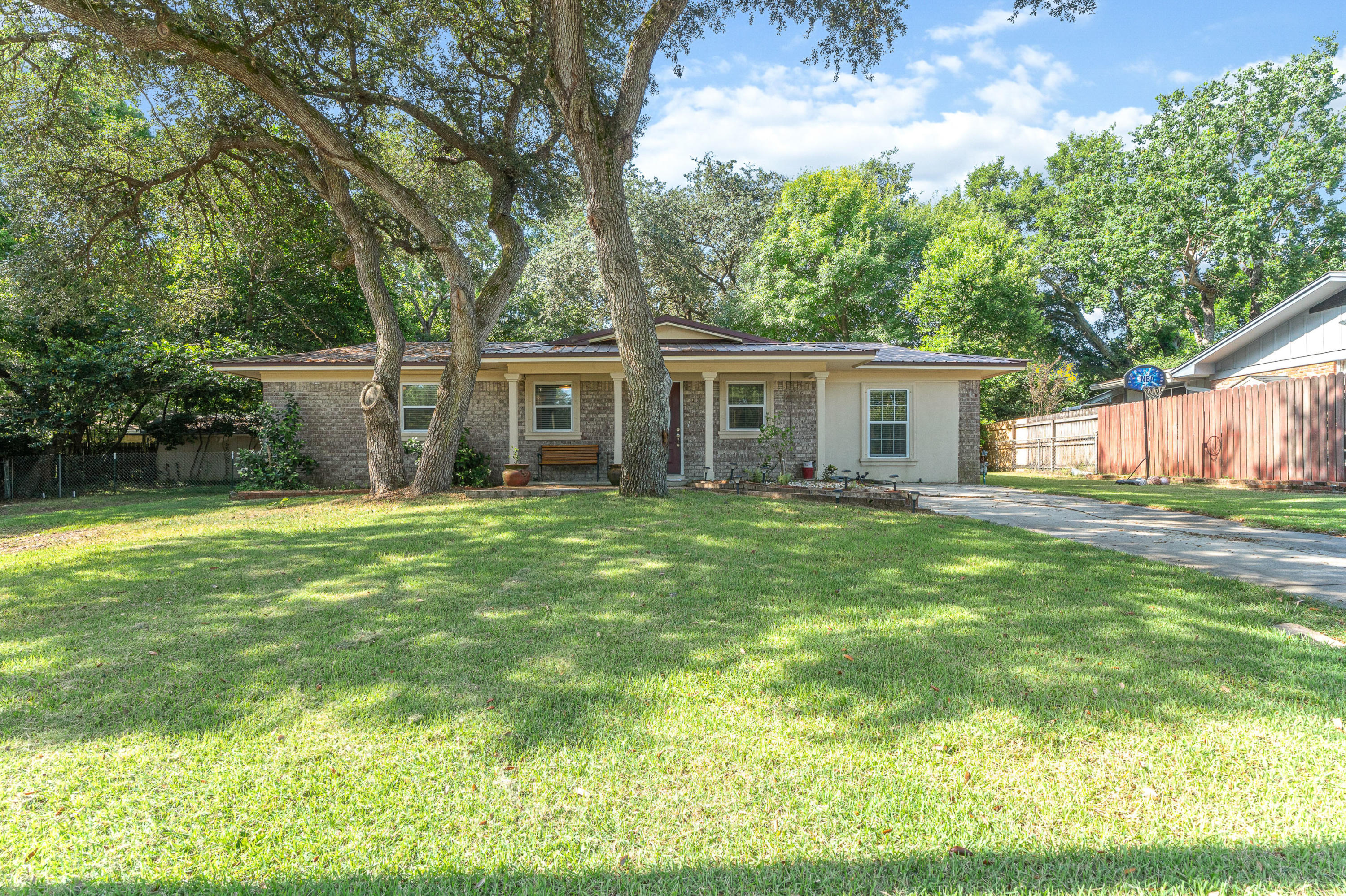 Come and walk through this cozy 4 bedroom home nestled in a quiet cul de sac with a close proximity to Eglin! This home is also about 15 minutes to Hurlburt! This home features a living room, family room, and dining area! The home has an updated kitchen with Stainless Steel appliances and granite countertops. It also has a Metal roof, newer sliding glass door, new duct system, and upgraded insulation! The home also has flooring throughout! Finish your home tour by checking out the large fenced backyard!Schedule an appointment today!