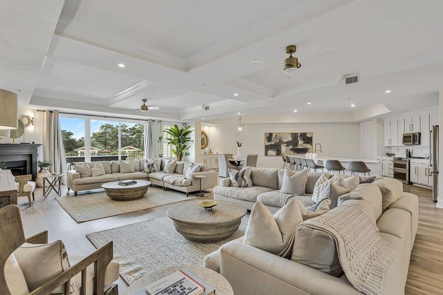 Experience an unparalleled blend of luxury, privacy, and resort-style living in this extraordinary four-bedroom, four-bath residence spanning more than 4,000 square feet in Sanctuary at Redfish. This immaculate condo lives like a single-family home while offering the lock-and-leave convenience of a premier gated retreat, perfectly positioned between the Gulf of Mexico and the rare coastal dune lake, Big Redfish Lake. The grand main living space welcomes you with multiple seating areas, a soft neutral palette, coffered ceilings, and oversized windows that flood the space with natural light and serene views of the resort-style pool below. Designed for both entertaining and effortless everyday living, the open-concept layout flows seamlessly into a gourmet kitchen featuring an extra-long island with seating for eight, quartz countertops, custom cabinetry, and premium stainless steel appliances, with two dedicated dining spaces anchored by a sculptural chandelier that elevates every gathering. Each of the four bedrooms is thoughtfully designed and generously scaled. The primary suite serves as a private sanctuary with its own seating area, luxurious ensuite bath, and private balcony access, while a second upstairs bedroom also offers balcony access for an additional outdoor retreat. The remaining guest suites include stylish furnishings, spacious layouts, and access to well-appointed baths, including a charming bunk suite ideal for families. The spa-inspired primary bath showcases a freestanding soaking tub, walk-in shower, dual vanities, and custom built-ins for a true luxury experience. Enjoy tranquil vistas from the living room and upper balconies overlooking the expansive pool complex and the preserved natural landscape surrounding Big Redfish Lake, offering a rare sense of privacy while remaining moments from the energy and amenities of 30A. Sanctuary at Redfish enhances this exceptional residence with an expansive four-pool oasis, private beach access via a signature pontoon boat shuttle across Big Redfish Lake, a scenic walking path to the gulf, a fitness center, beautifully landscaped grounds, lakefront fire pits, poolside cabanas, grilling stations, 24-hour gated security, and climate-controlled owner storage. This rare combination of space, serenity, and resort-level amenities creates a unique lake-to-beach lifestyle found only at Sanctuary at Redfish, delivering an elevated coastal haven where elegance and comfort meet the natural beauty of 30A.