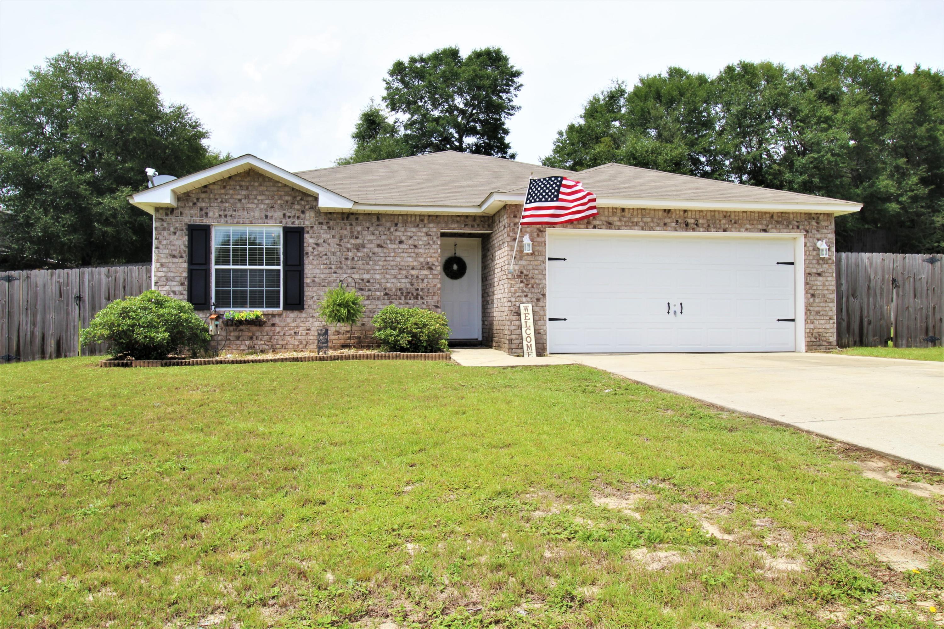 Located south of Hwy 90 and tucked away in a private community, this one owner home is well maintained and move-in ready. 4 bedrooms with a double split floor-plan provides privacy, while the high vaulted ceilings and open living area feel spacious and welcoming. Home has a brick front exterior and large, privacy fenced, back yard. Seller is offering a $1,500 credit for flooring and a home warranty with a full price contract.