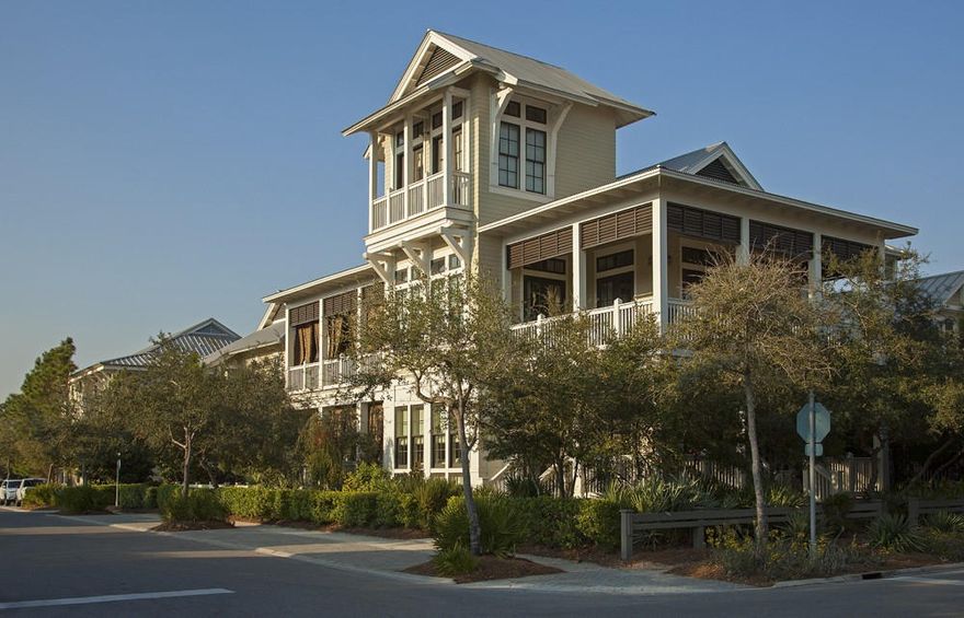 This Park District home is perfectly located in Watercolor. Close to shopping, the boathouse, the beach club and Gulf, yet it lives very privately. The reverse floor plan home has unique features like antique wood floors, 12-foot ceilings, and exposed beams.Downstairs are three bedrooms, all with ensuite baths. A large light filled living area includes an alcove for dining or games. Access to porches on two sides of the home make indoor/outdoor living a breeze.Upstairs is an open kitchen, living and dining area that enhances entertaining. An island/breakfast bar and a large dining table provides plenty of room for a large family or guests. The kitchen opens onto a porch with great views and privacy. The Master Suite is on this floor as well, allowing one floor living. There