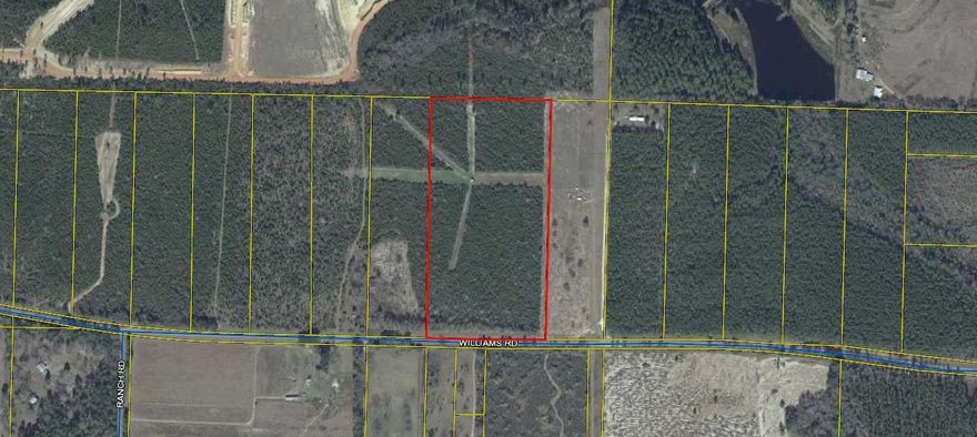 Nice acreage on Paved Rd  close to town. Deed restricted, no mobile homes