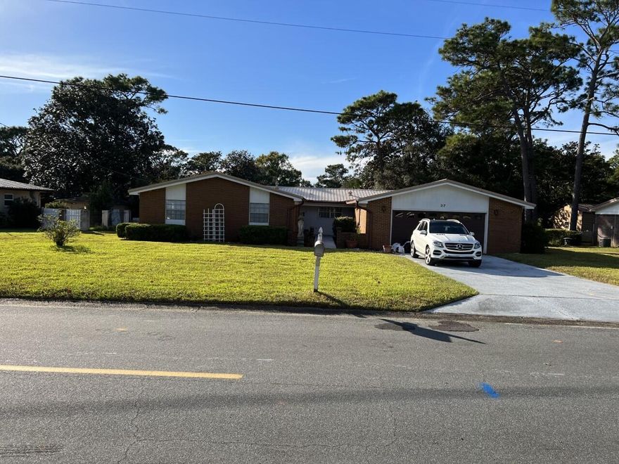 Highly desired neighborhood in Poquito Bayou.  Just minutes from the bases and beaches.  You will love the boat ramp located in the neighborhood, and separate park with dock for fishing and picnics.  Come see this very well maintained 4 bedroom, 2 bath home with very large Rec. room or den, along with a large family room, which makes it excellent for entertaining.   This home is immaculate!!   The yard is easily maintained with the sprinkler system that has been installed.  The back yard is large and can easily have a pool, swing set and still have plenty of room for your fur babies.  The medal roof was installed in 2005.  The garage is oversized and can easily hold two vehicles.  Washer and dryer hookups are located in the home and in the garage.  If you have a green thumb, you'll love the greenhouse!! Call today for a viewing. This will not last long!!