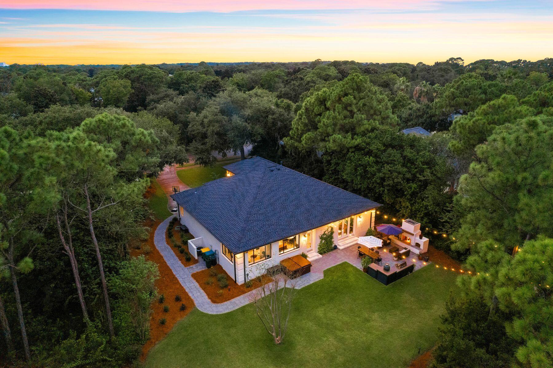 Set apart on an urban island within the prestigious Kelly Plantation, this elite home sits on 0.41 acres backing onto a lush nature preserve. The expansive lot provides uncompromising privacy with unspoiled natural surroundings in all directions. Built with careful precision and style, the combination of brick over concrete block and metal stud framing creates a home that is both durable and aesthetically pleasing. It has a new shingle roof and water heater in 2021 along with new LVP flooring. The grand doorway opens into an elegant hall, which leads into a series of bright open living spaces. The gourmet kitchen will demand your attention with its shiplap walls, abundant white cabinets, quartz countertops and monochrome island. Chairs are lined up ready for serving speedy breakfasts on
