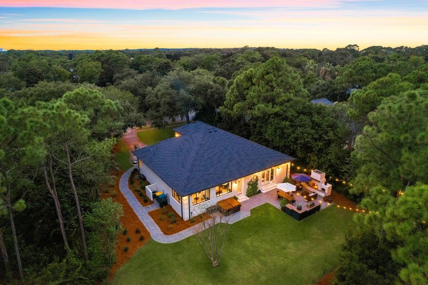 Set apart on an urban island within the prestigious Kelly Plantation, this elite home sits on 0.41 acres backing onto a lush nature preserve. The expansive lot provides uncompromising privacy with unspoiled natural surroundings in all directions. Built with careful precision and style, the combination of brick over concrete block and metal stud framing creates a home that is both durable and aesthetically pleasing. It has a new shingle roof and water heater in 2021 along with new LVP flooring. The grand doorway opens into an elegant hall, which leads into a series of bright open living spaces. The gourmet kitchen will demand your attention with its shiplap walls, abundant white cabinets, quartz countertops and monochrome island. Chairs are lined up ready for serving speedy breakfasts on