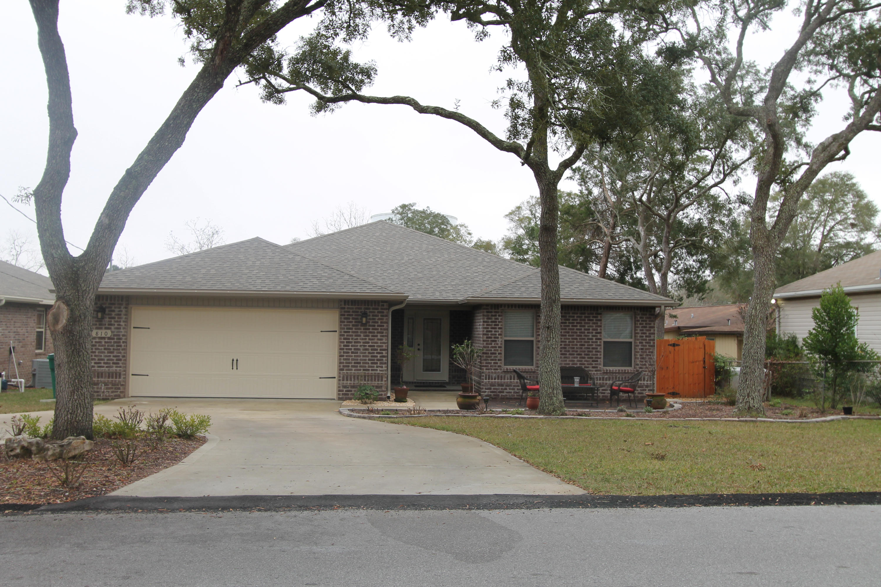 Better than new. This 4/2, one owner home, was built in 2013 on nearly 1/3 of an acre. The numerous upgrades that the SELLERS have added to home include a fully fenced rear yard, gas range, huge concrete addition at rear with dual sitting areas/ patios, custom metal railings on rear porch, a brick paver front patio, gutters and TONS of tropical landscaping. Kitchen boasts stainless appliances, maple cabinetry, granite countertops, breakfast bar and dining area. The greatroom is oversized, has a trayed ceiling with rope lighting, and french doors with built in blinds that open to the covered porch and 2 patios, just perfect for entertaining. The master suite has a large bedroom with trayed ceiling, double vanity, separate garden tub and shower, a large walk in closet, and a private