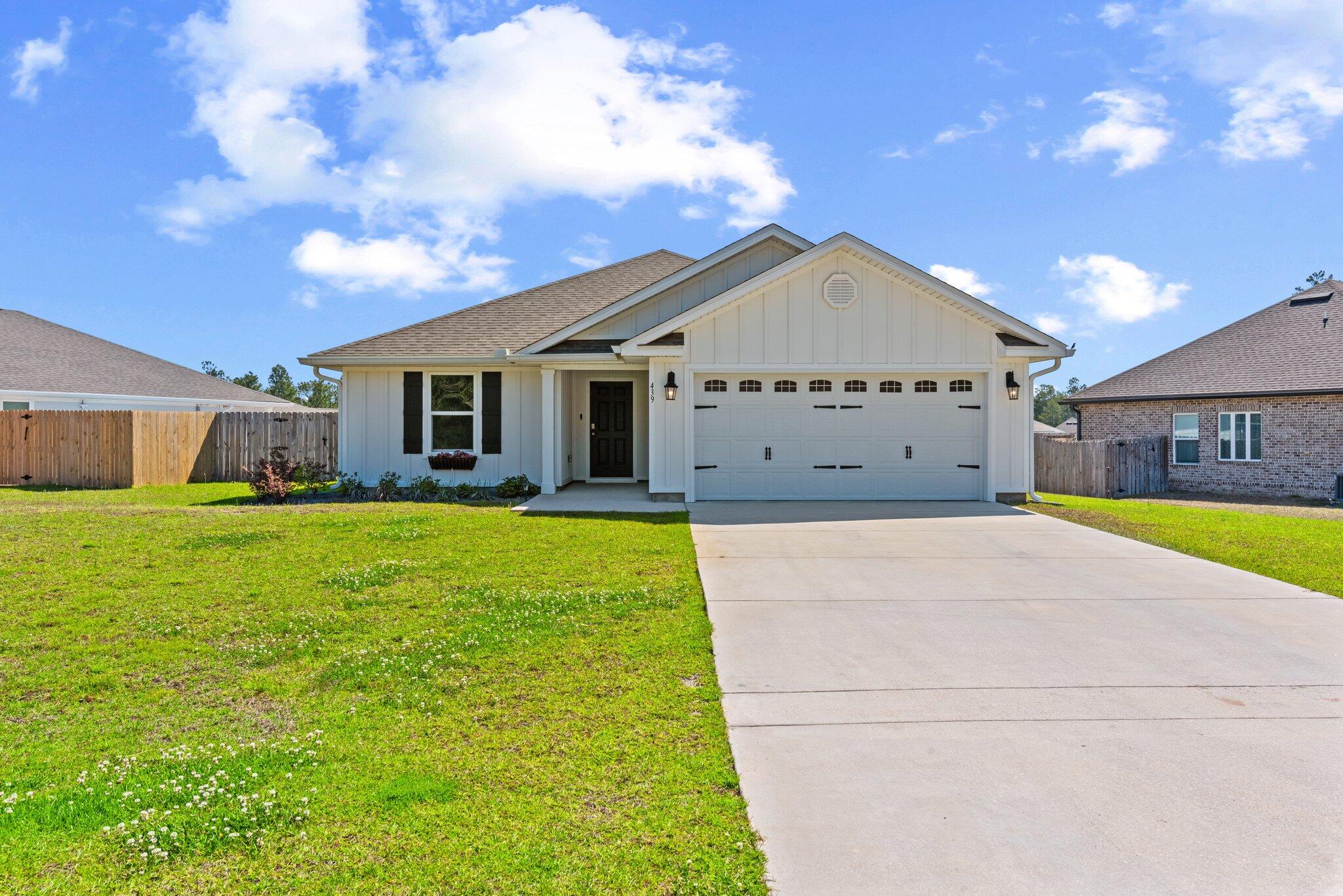 Like-new former model home on a premium elevated lot! This beautifully maintained 3BR/2BA home in Freeport features an open-concept layout, luxury vinyl plank flooring, and a fully fenced backyard. The standout feature is the finished garage, complete with LVP floors, recessed lighting, and its own mini-split HVAC system--ideal for a gym, studio, or climate-controlled flex space. Lightly lived in and loaded with upgrades, this home offers privacy, space, and functionality in one of Freeport's most desirable communities. Just minutes from schools, shopping, and the beaches of South Walton