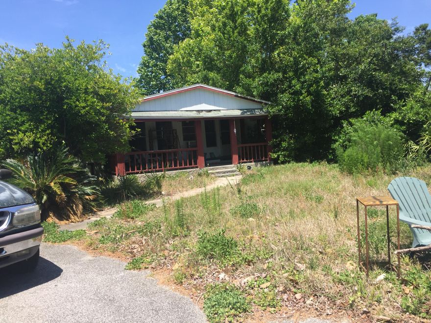 LOCATION, LOCATION, LOCATION. THIS LOT IS CENTRALLY LOCATED AND IS CLOSE TO SHOPPING AND GREAT RESTAURANTS. THE STREET IS ON A CUL-DE-SAC SO VERY LITTLE TRAFFIC. IT WOULD BE A GREAT PLACE TO BUILD OR TO PUT A MANUFACTURED HOME ON AS IT ALREADY HAS THE SLAB. THIS IS AN ''AS-IS'' LISTING. THE MANUFACTURED HOME ON THE PROPERTY IS CURRENTLY UNINHABITABLE. THE PRICE REFLECTS FOR THE LOT ONLY. PLEASE ENTER THE PROPERTY AT YOUR OWN RISK.