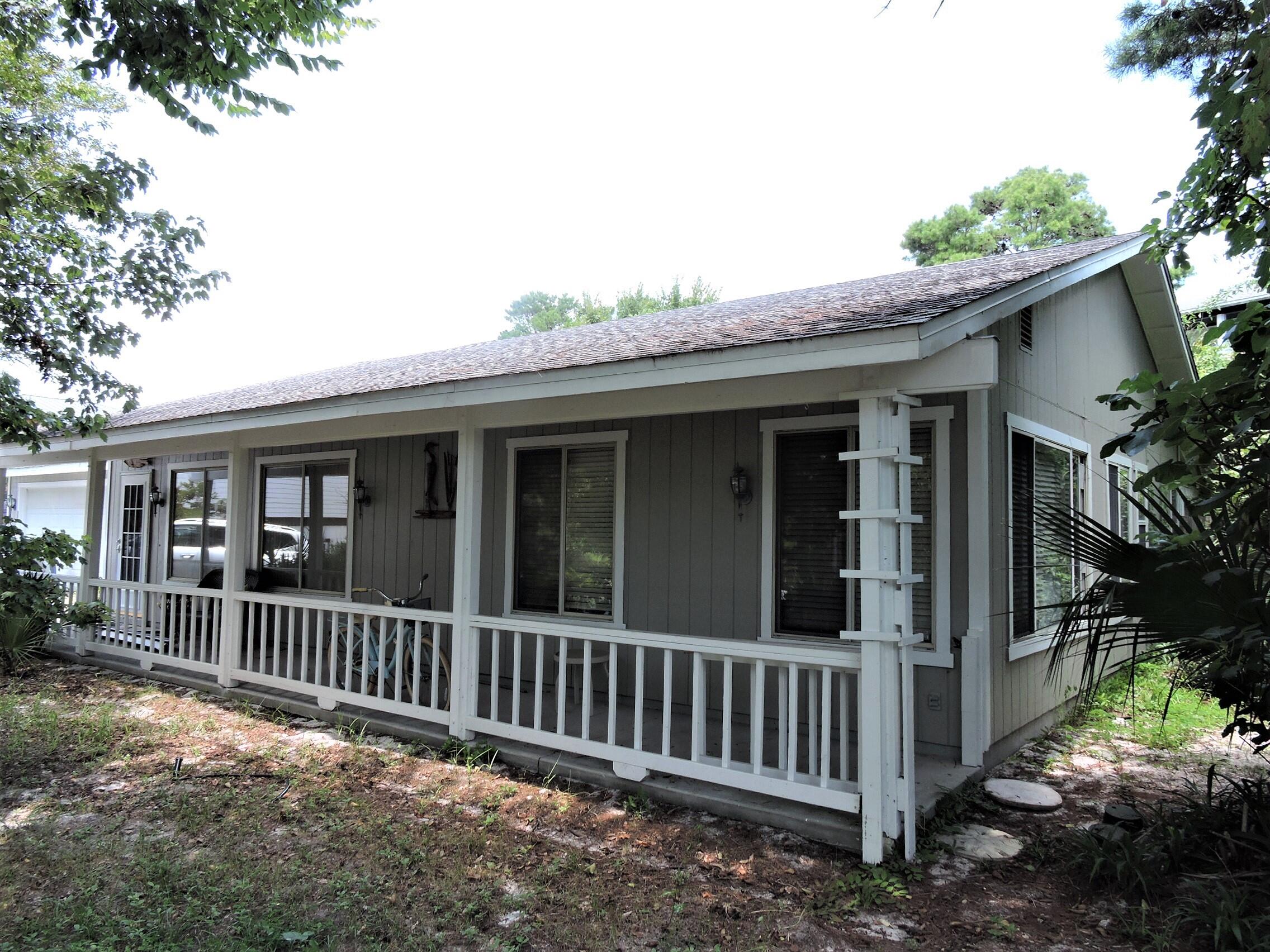 Blue Mountain is one of the highest points on 30A & close to all the great 30A restaurants and night life! This cool beach retreat is cute as a button & has PLENTY of room for expansion as it is on a LARGE .5 acre lot. Home is light and bright w/windows all along the back side looking out on the expansive back yard. Kitchen is open to the back porch & has a ton of storage. Right off the kitchen is a breakfast/sitting area. Back porch provides plenty of hang out room. Primary bedroom has a walk-in closet and a gorgeous bathroom w/double vanities & walk-in shower. Second bedroom is a great size and is next to the second bath. Through the garage is a 3rd bed or office. Garage would be great converted to another bed and bath! Plenty of room for a pool/guest house. Roof 2008.
