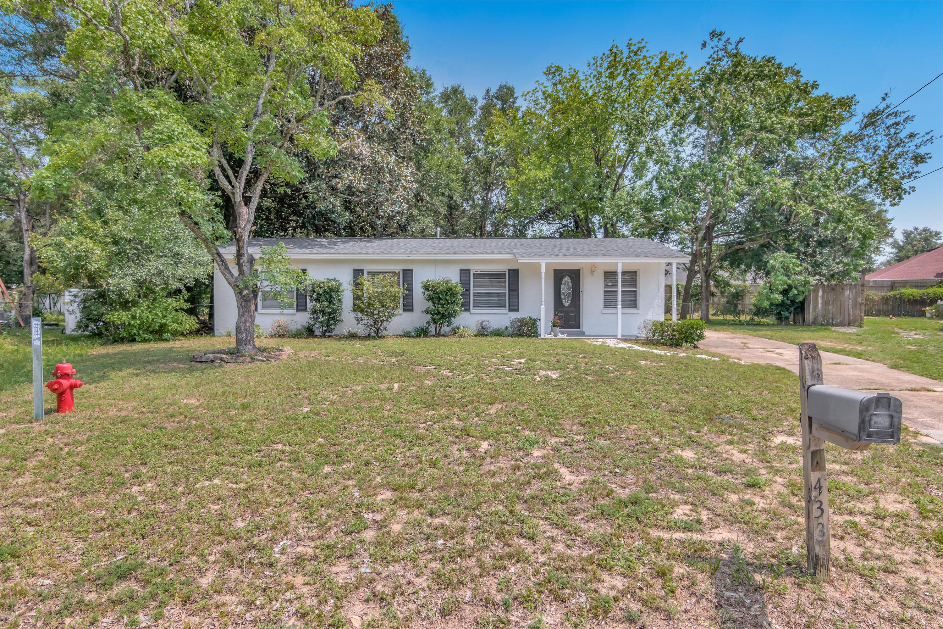 Well maintained four bedroom home minutes from FWB Medical Center and conveniently situated between Hurlburt Field and Eglin Afb! Tile flooring throughout, newer ceilings fans in all bedrooms, kitchen and dining. The galley-style kitchen features newer 2021 stainless steel appliances and a breakfast nook at the end perfect for a coffee or beverage bar! Flex room accessible by a walk-through where glass french doors open to the wooden deck and sizable backyard. 2021 Roof, Interior AC Components 2016, Heater 2016.
