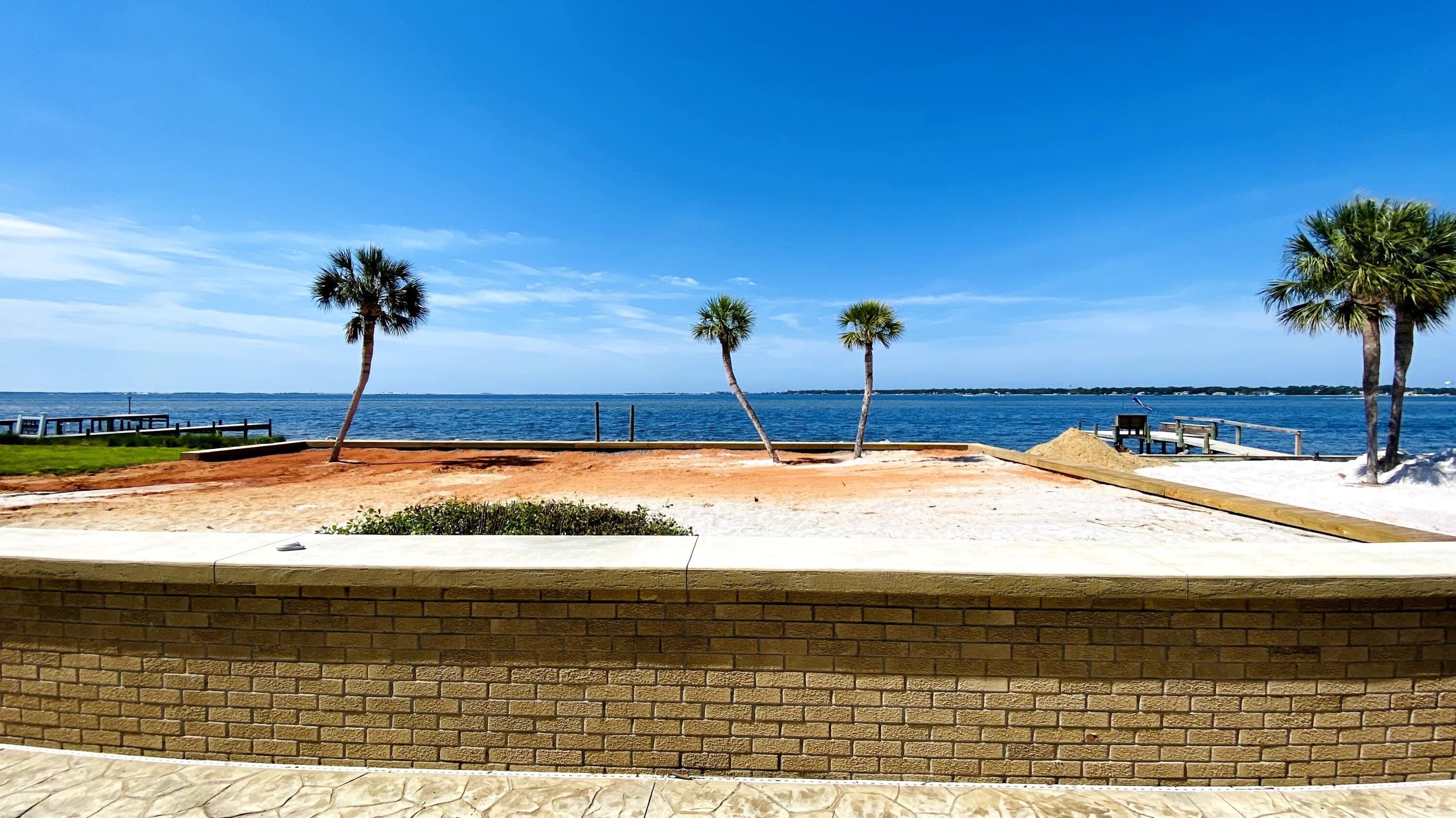 Waterfront Living at its best w/views of Lake Vivian and Choctawhatchee Bay! Stunning Waterfront oasis in Shalimar, FL! Bring your boat to your private dock with Covered Boat lift. This 3-bedroom, 2.5 bath home has been updated with all the hurricane rated protections: New Seawall (2021), Concrete retention wall, Whole House generator, Metal Roof (2015), roll down hurricane shutters, Custom water-tight sliding glass doors throughout, raised A/C system (2016), front door with 3 lock system, and new garage door. Custom kitchen w/all stainless-steel appliances, plenty of cabinets w/ soft close drawers, 2 ovens (gas & electric), Gas stove w/Hood vent, beautiful quartz countertops with custom backsplash, center island w/ breakfast bar all with views of the bay! Watch the dolphins play in your