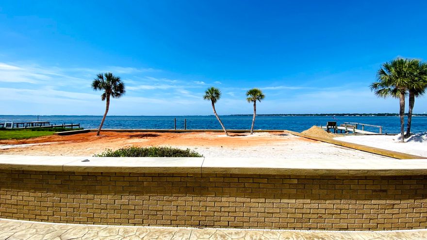 Waterfront Living at its best w/views of Lake Vivian and Choctawhatchee Bay! Stunning Waterfront oasis in Shalimar, FL! Bring your boat to your private dock with Covered Boat lift. This 3-bedroom, 2.5 bath home has been updated with all the hurricane rated protections: New Seawall (2021), Concrete retention wall, Whole House generator, Metal Roof (2015), roll down hurricane shutters, Custom water-tight sliding glass doors throughout, raised A/C system (2016), front door with 3 lock system, and new garage door. Custom kitchen w/all stainless-steel appliances, plenty of cabinets w/ soft close drawers, 2 ovens (gas & electric), Gas stove w/Hood vent, beautiful quartz countertops with custom backsplash, center island w/ breakfast bar all with views of the bay! Watch the dolphins play in your
