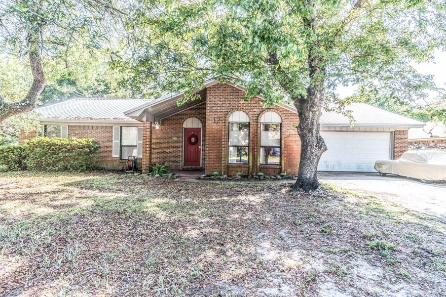 3 bedroom 2 bathroom with a 2 car garage just minutes from the water! This home has a seperate living/dining and great family room with brick fireplace. This home has a fully fenced yard and large screened in patio! Newer AC and roof! All appliances except washer and dryer included!