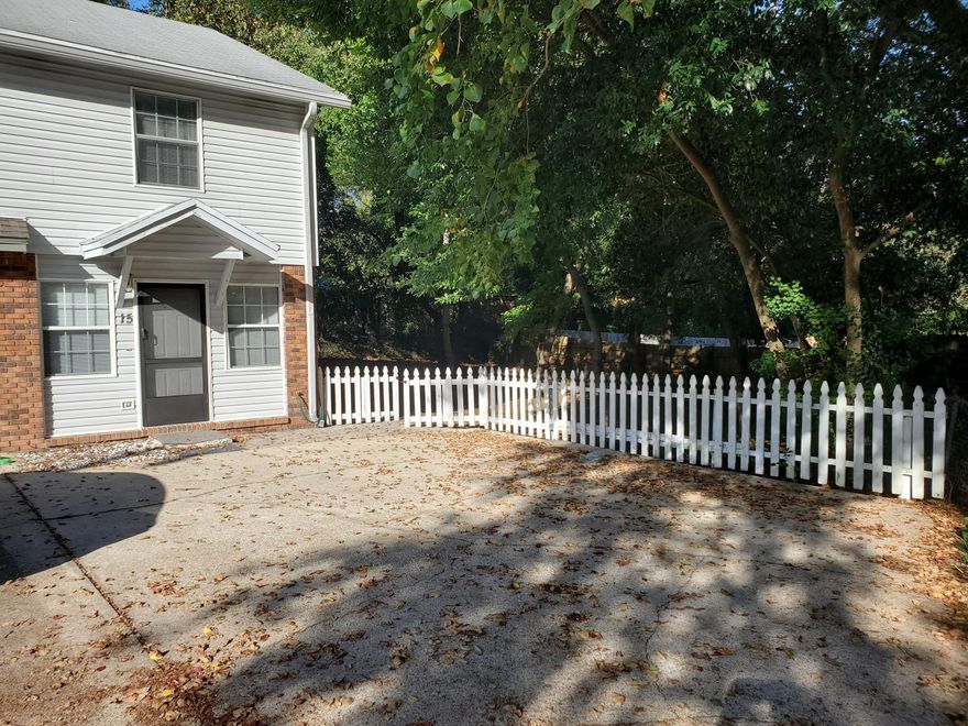 END UNIT WITH HUGE SIDE YARD! VERY PRIVATE. PLENTY OF ROOM FOR YOUR DOGS TO ROAM. Can have an outside storage unit or workshop, plenty of yard to do so. No Association so do what you want. This End Unit Townhome offers Tile flooring downstair throughout for easy maintenance. Cute kitchen with stainless refridgerator. Laundry off the kitchen as well as half bath. Even room for a kitchen table in dinning area. Newer carpet on stairs and all upstairs. Spacious master bedroom with his and her closets. 2 Bedrooms and 1 full bath. Roof and AC seem in great condition and Vinyl siding for easy maintenance. Unit is in Move In Ready Condition. Extra storage under the stairs. This can be your primary residence or rental, you decide. Won't last long call today!