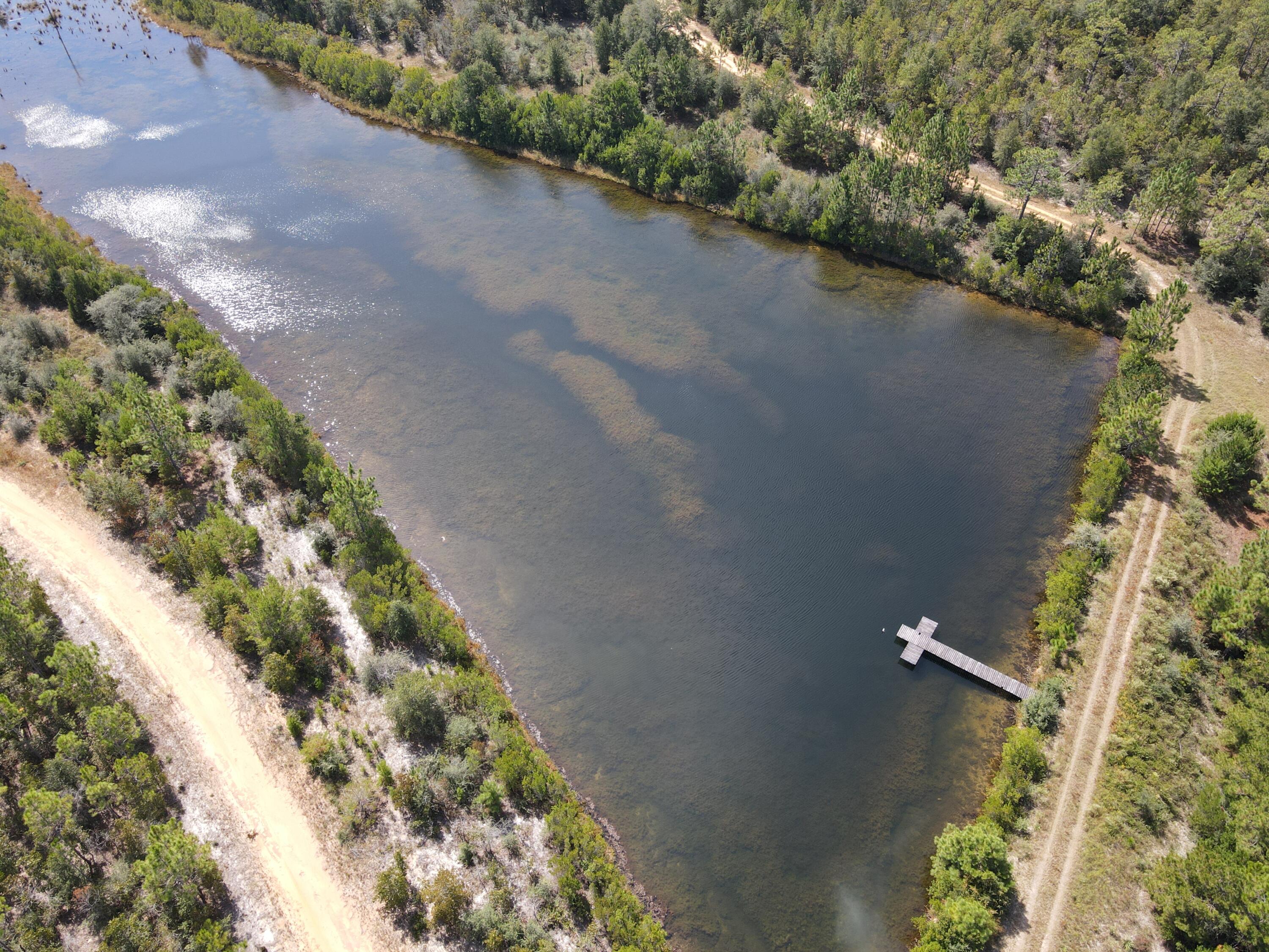 Largest acreage tract anywhere in the Florida Panhandle currently offered for sale.  Development Potential. Close to the Interstate and Hwy 331. 30 minutes to the white sandy beaches of South Walton. Located 5 minutes out of historic Defuniak Springs, FL. Approximately 2.5 miles of river frontage at the origin of Shoal River. Property features tons of deer and turkey, two beautiful lakes stocked with bass and bream. Perfect for recreation or holding for development.