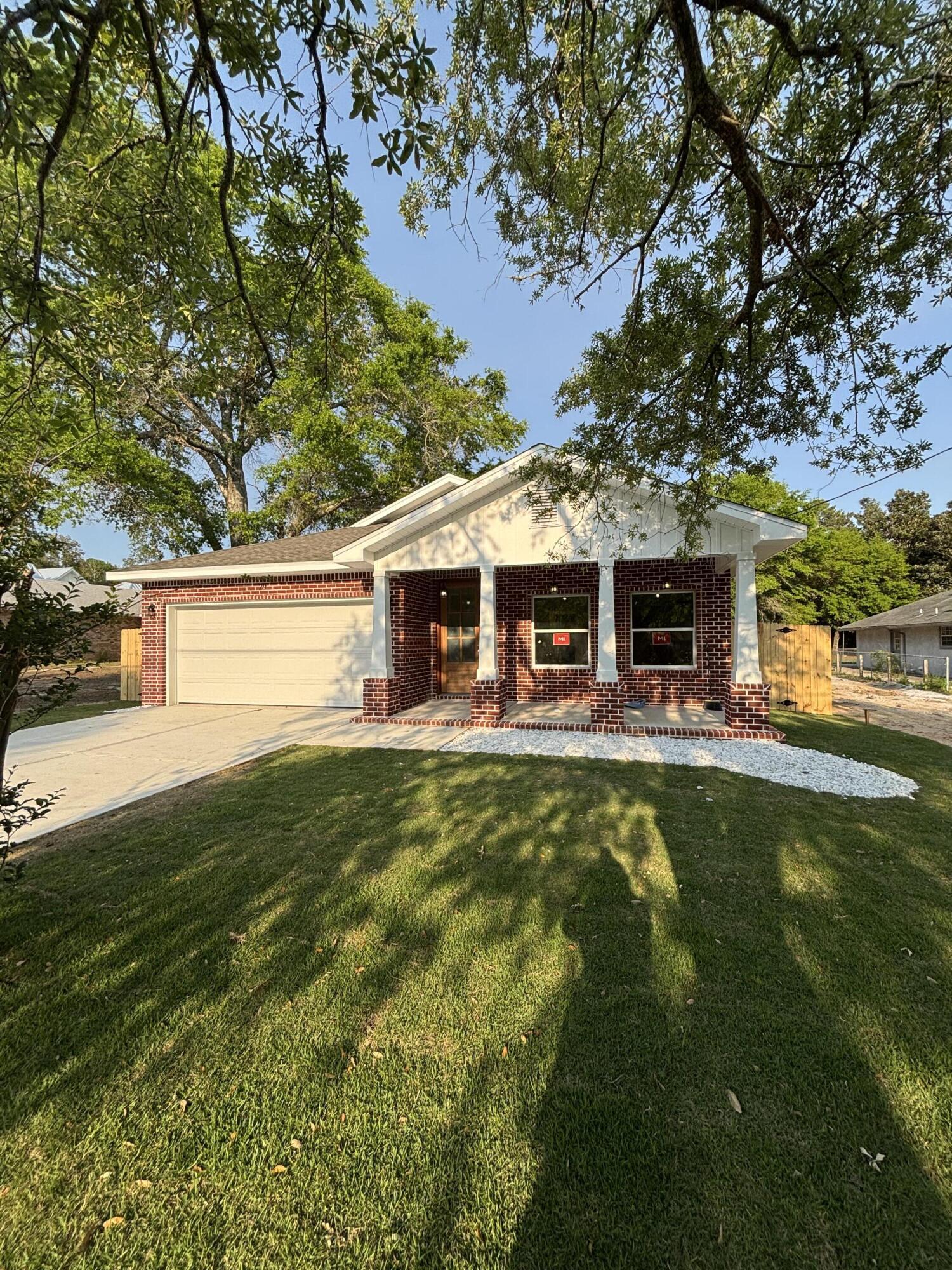 This beautiful 4-bedroom, 3-bath brick home combines timeless design with modern touches. A custom 8-foot mahogany wood front door sets the tone for the quality and charm found throughout. The kitchen is equipped with an oversized fridge and freezer, complemented by a wet bar and separate drink fridgeperfect for entertaining.The primary suite offers a floor-to-ceiling tiled shower, a 6-foot soaking tub, private water closet, and separate his and her closets.Outside, enjoy a large, gorgeous oak tree filled yard with a spacious back porch, RV pad with a double gate, and room to add a pool. A two-car garage provides secure parking and storage. This home is a perfect mix of comfort, luxury, and functionality.