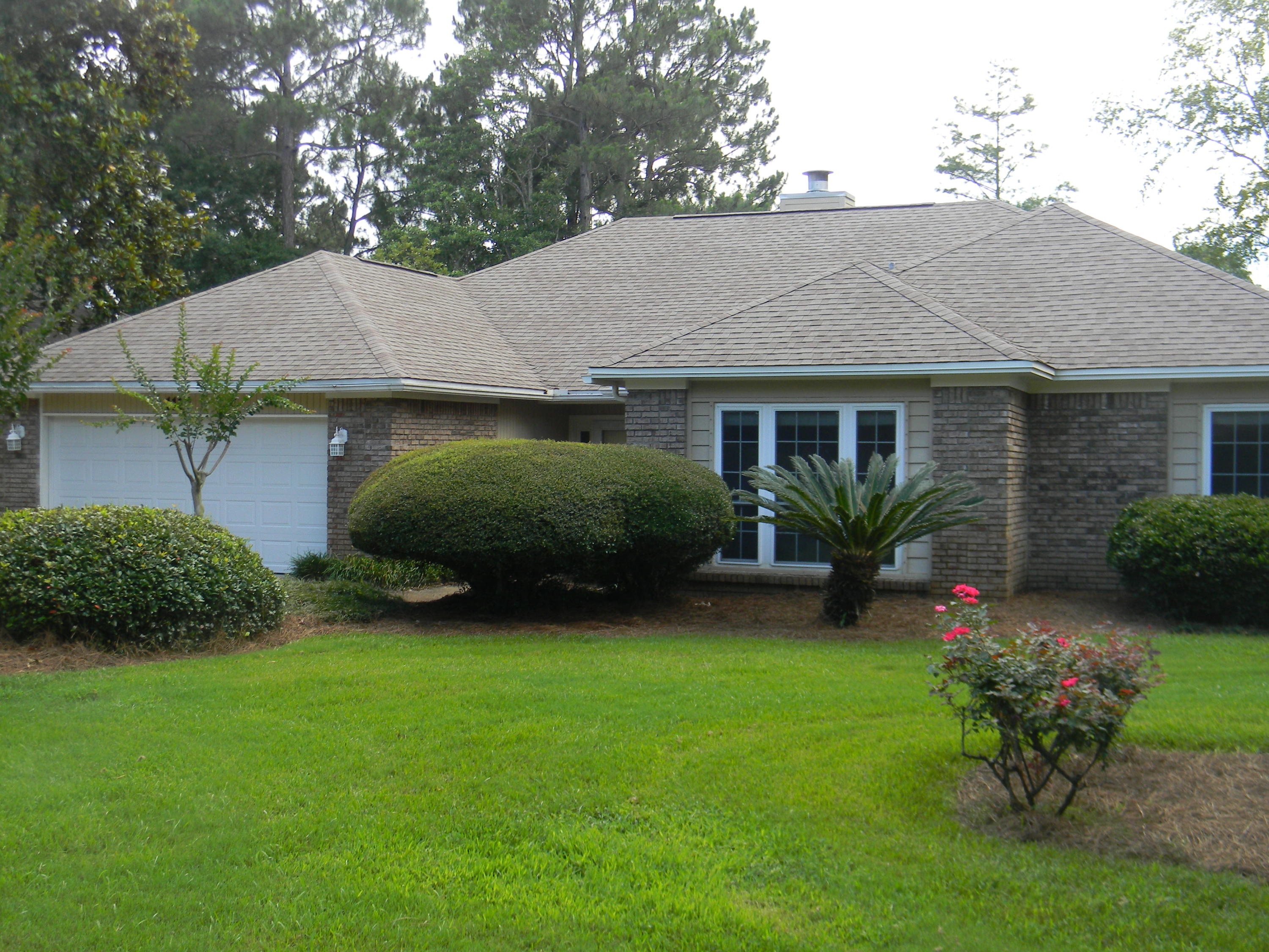 Well-maintained 4 bedroom 2.5 bath brick home which opens up to the formal living room. All interior walls and trim just painted. All new storm windows 2009, 2010 new garage door, and metal storm shutters, new tile 2012 kitchen and baths. The formal dining room overlooks the golf course (3rd tee of the Bay Course. Great kitchen with a g.c. view, recessed ceiling lighting, walk-in pantry. The bay window eating area is glass-wrapped for a great view. Kitchen appliances recent. Spacious family room which has a fireplace and built-in bookshelves! Master bedroom has two closets and a large master bath with tub and separate shower and skylights to for natural light. Central vac, termite bond, home warranty in place. BlueWater Bay boasts pools, tennis, golf course, walking trails and marina area.