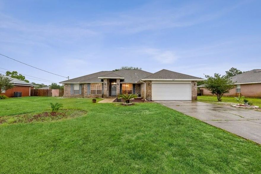 SELLER TO REPLACE ROOF BEFORE CLOSING! This massive brick beauty on a half an acre lot has a split floor plan that includes a separate master bedroom, formal dining area, breakfast nook, newer appliances and cabinetry, laminate and tile floors, a lengthy driveway for potential RV parking, large backyard with an expanded patio and only 10 minutes from Navarre Beach! The master bathroom includes his and her closets, jacuzzi-style tub, and private toilet with door. The shed, washer/dryer, termite bond, and hurricane shutters all convey. The $455 annual HOA fee includes a community pool, game room, event room, dock, boat launch, tennis and pickle ball courts, and a gym with a sauna. A small price to pay for all the amenities provided! Why would you not buy this house!?