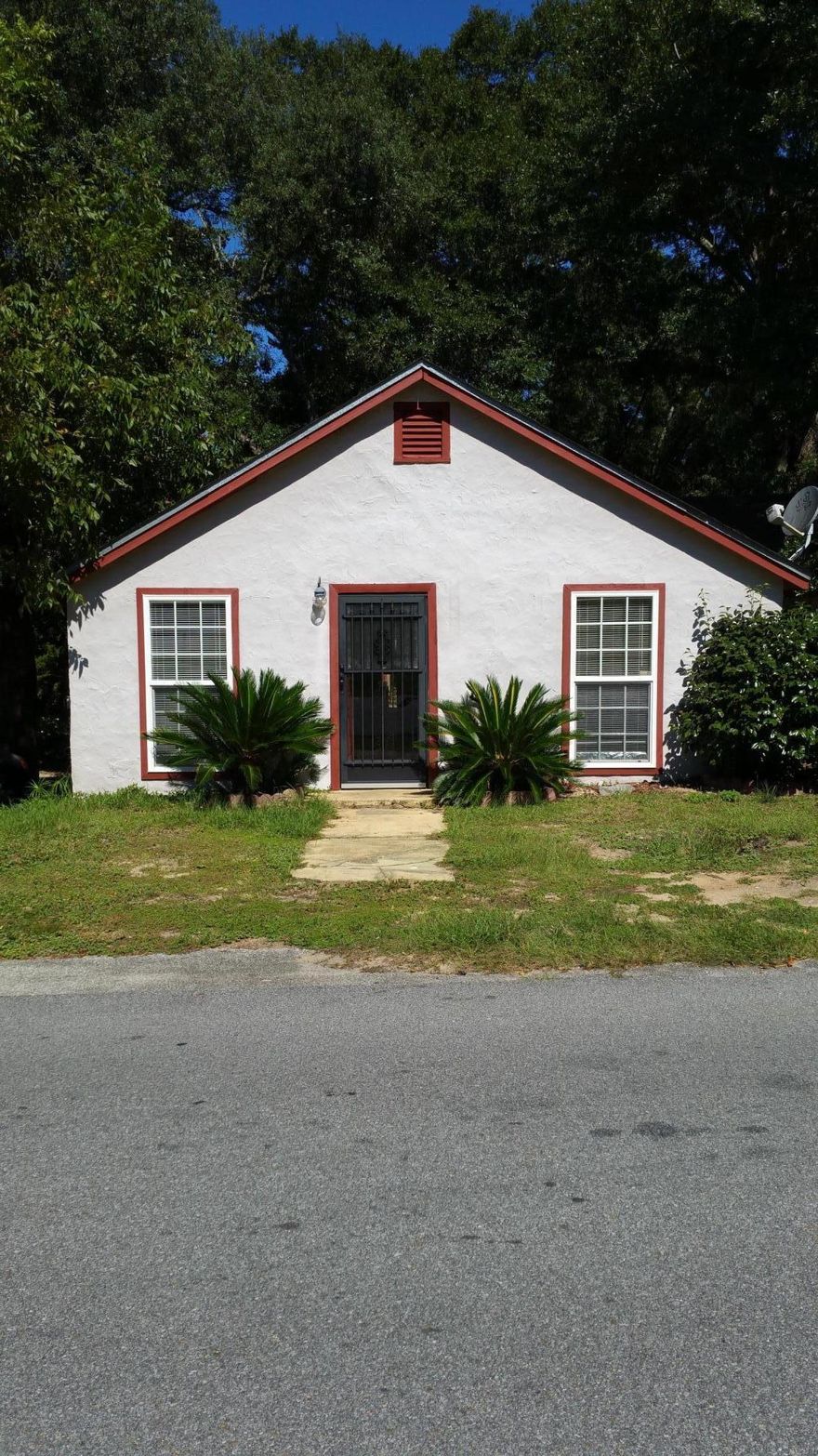 This home is located in downtown Crestview. Convent to shopping, restaurants, and schools. Home has some updates which include hardwood floors, new sewer lines, bathroom and new windows. It is perfect for an investment or making into your own home. Don't let this deal pass you up. This property can be zoned as a Commercial Property. Please verify zoning, school zones, other information