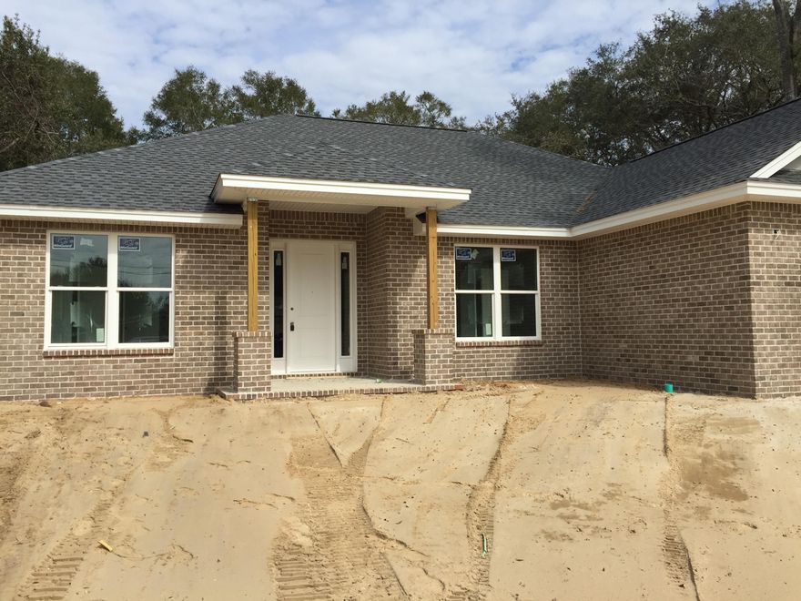 Brand NEW CONSTRUCTION in the heart of Niceville. // Beautiful BRICK 4/2 with SPLIT FLOOR PLAN // OPEN FLOOR PLAN // Light & Bright motif // White Shaker cabinets, GRANITE, farm sink, huge laundry room and much more! There is also a detached garage on property which would make a fantastic WORKSHOP, storage, etc. // Garage was built by previous owner and is being sold as-is (however builder is putting new roof on garage). Home is currently under construction but should be COMPLETED BY SPRING // All information is deemed accurate but not guaranteed and buyer should verify anything of importance. // Note: floorplan in photos is flipped; house is built as right front garage.
