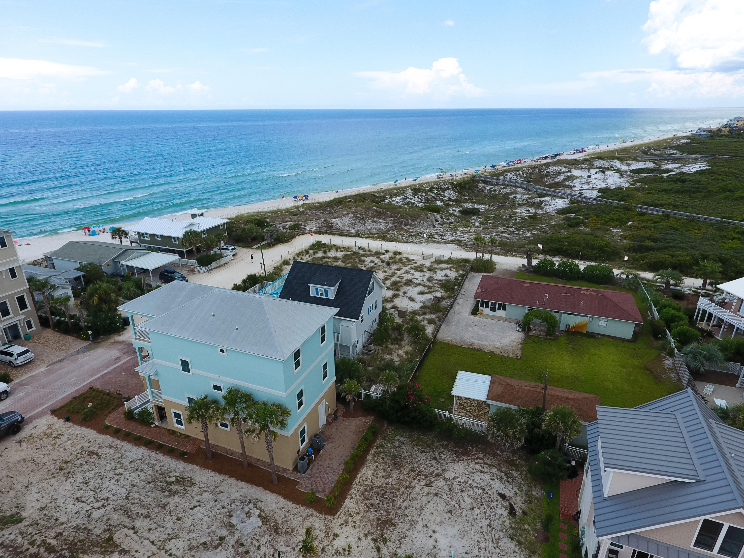 Adorable beach house sitting on a great home site with amazing FOREVER views over the State Park.This property is selling with the vacant land to the west. Seller will only sell together. One of the last large view lots available in Inlet Beach or along 30A. As good as gulf front. Beautiful state park with rolling protected dunes offers great board walks to the beach. Come build your huge family compound with room for two homes, a pool, carriage house and parking. Just off the beaten path but close enough to walk or bike to Rosemary Beach, 30Avenue and all 30A has to offer. Price includes the vacant land to the west.
