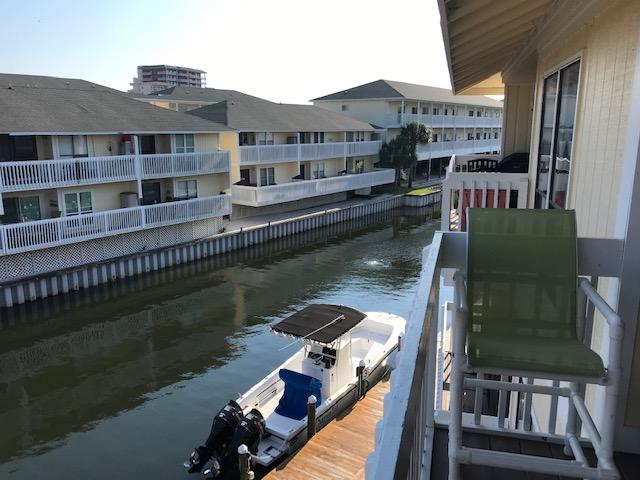 Tastefully remodeled large one bedroom overlooks canal dock. New kitchen, Lighting, HVAC. Wood-look vinyl laminate flooring throughout with tile in bath.Fully furnished and rental ready. Good rental history.Central location within the 43 acre Sandpiper Cove Resort. 1100' beach access, seasonal snack bar and chair/umbrella service. Boat launch, boat docking along the canal by reservation. 5 pools to choose from. 2 heated in winter months. 6 tennis courts, shuffleboard, bocci ball, pickle ball. On-site gourmet restaurant, Louisiana Lagniappe open year around. Sandpiper Cove is in easy walking distance to various shopping, restaurants, Target, Winn-Dixie, Walgreens & More!
