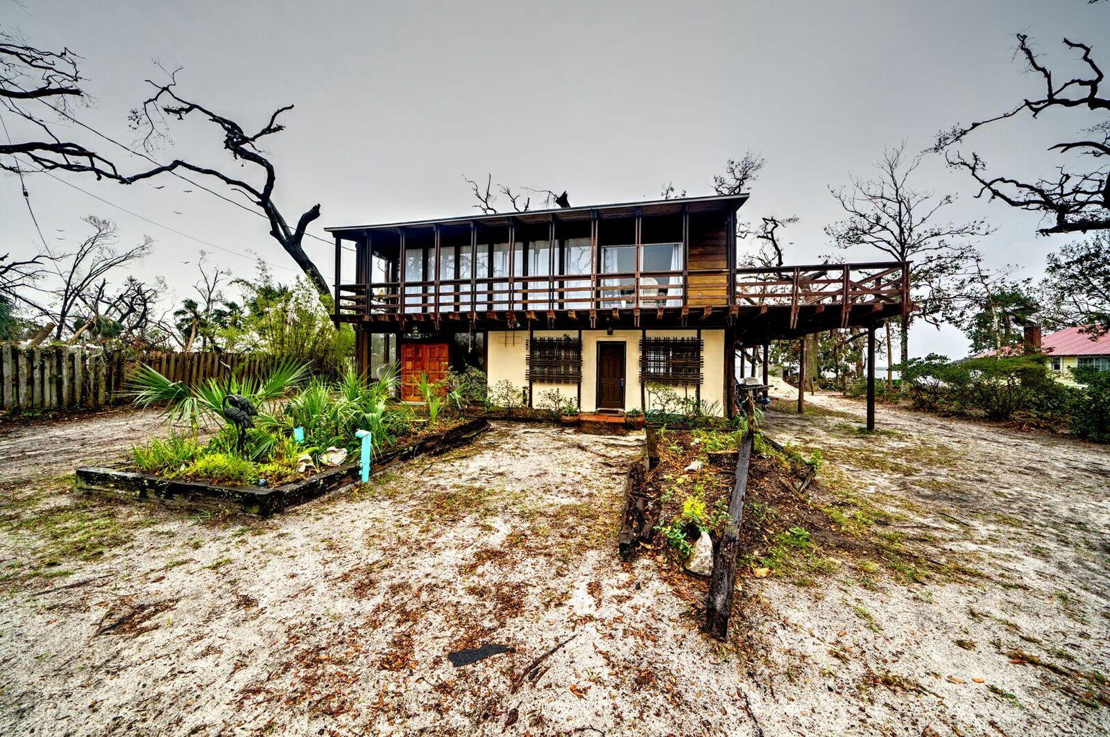 100% financing available for Hurricane Michael disaster victims (rental or owner) via 203h loan. No HOA, no flood insurance required. Comes furnished. Bay County Historians nicknamed this home the ''Hurricane Home'' because it has been used as a safe haven for decades from hurricanes including Opal and Michael. This home has been the entertainment home for families from around the U.S. and has been a wedding venue for many newlyweds. This absolutely spectacular waterfront home boasts 110 waterfront feet, a salt-water / commercial grade infinity pool, and 1 Bedroom / 1 Bathroom apartment that can be utilized as a rental investment property.