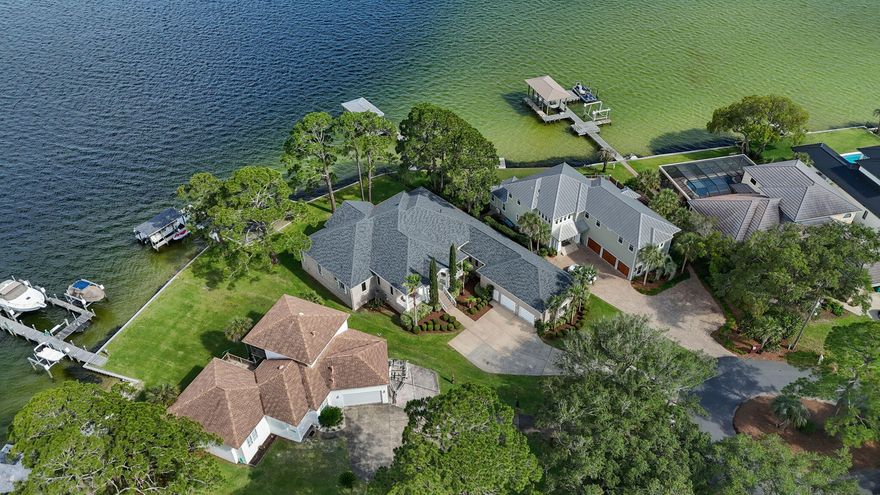 Tucked away at the end of a quiet, private cul-de-sac in sought-after Shalimar, this stunning waterfront property offers the kind of lifestyle that rarely comes along--a setting for stories, memories, and the simple joy of life by the water. With approximately 144 feet of deep water frontage and direct boating access, this is where everyday life feels like a getaway. As you approach, a charming front porch welcomes you in, while lush, manicured grass leads the way to your own private waterfront haven. Step inside to find soaring ceilings and crown molding throughout, setting the tone for elegance and ease. The open, split floor plan offers a seamless flow between living spaces, and nearly every room is kissed by panoramic water views, from the living areas to multiple bedrooms. The kitchen is a hub of connection and comfort, with generous counter space, a view-filled breakfast nook, and sightlines straight to the water. The living area opens effortlessly onto an expansive back porch, perfect for morning coffee, sunset dinners, or simply taking in the peaceful rhythm of the bay.
The master suite is a true retreat, complete with water views, ample closet space, and a private bath. With 4 bedrooms, 3.5 baths, and multiple AC units, the home is designed for both comfort and functionality. The garage offers extensive storage and even a dedicated storage room for all your outdoor gear and boating essentials.
This is more than a home, it's a rare opportunity to own a one-of-a-kind piece of the Emerald Coast. Whether you're hosting or savoring quiet waterfront mornings, this is where memories are made.