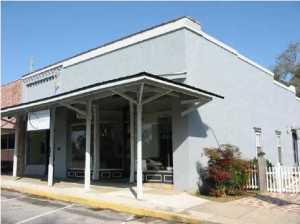 Incredable opportunity for someone looking in the Historic District of Defuniak Springs. This building was the King Hardware building of old and has been beautifully restored and updated. It has been placed on the National Historic Registry. Spacious office space and work areas, conference rooms, kitchen and even storage in the old original safe. A lovely patio area is on the side of the building. Some original hardwood flooring as well as a mural painted by a local artist.