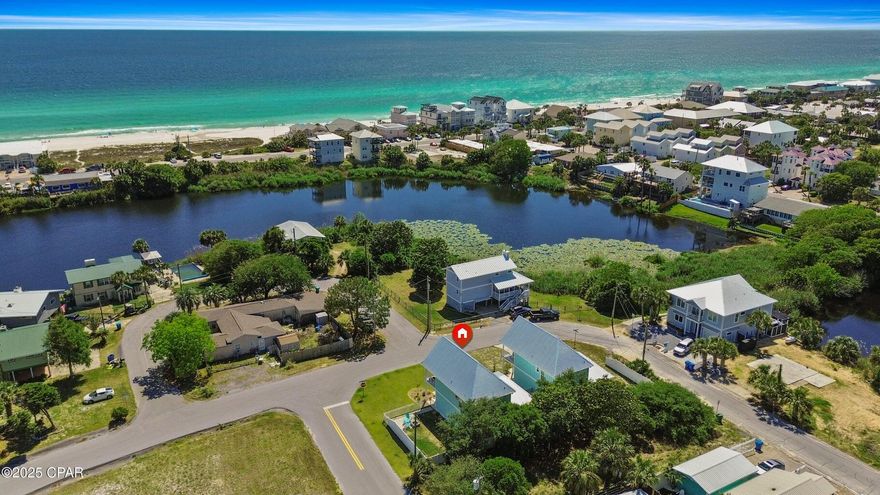 Just a few blocks from the sugar-white sands and emerald waters of the Gulf, this move-in ready coastal retreat is the perfect blend of comfort, convenience, and investment potential. With 2 spacious bedrooms, 2.5 bathrooms, and a two-car garage, this well-maintained home offers low-maintenance living in a sought-after location on the west end of Panama City Beach. Inside, wood-look LVP flows throughout the bright, open layout. The kitchen is outfitted with granite countertops, stainless steel appliances, and painted cabinetry that complements the beachy, modern feel. A large island offers extra prep space and seating for casual dining or entertaining. Upstairs, the bedrooms offer generous space and privacy, with the primary suite opening to a private balcony overlooking the Gulfperfect for relaxing with your morning coffee or unwinding after a day in the sun. Outdoors, enjoy Gulf views from your covered balcony or relax in the fenced backyard, complete with an outdoor showerideal for rinsing off after the beach. A charming covered porch and tidy landscaping complete the picture. Located just west of Hwy 79, this home puts you close to local favorites like Thomas Donut & Snack Shop, Salty Sue's, and Carousel Supermarket. Pier Park's shopping, dining, and entertainment options are just a short drive away, and 30A is easily accessible for even more scenic coastal adventures. Whether you're looking for a full-time residence, a vacation home, or a turnkey short-term rental investment, this beachside property delivers coastal living with style and ease.