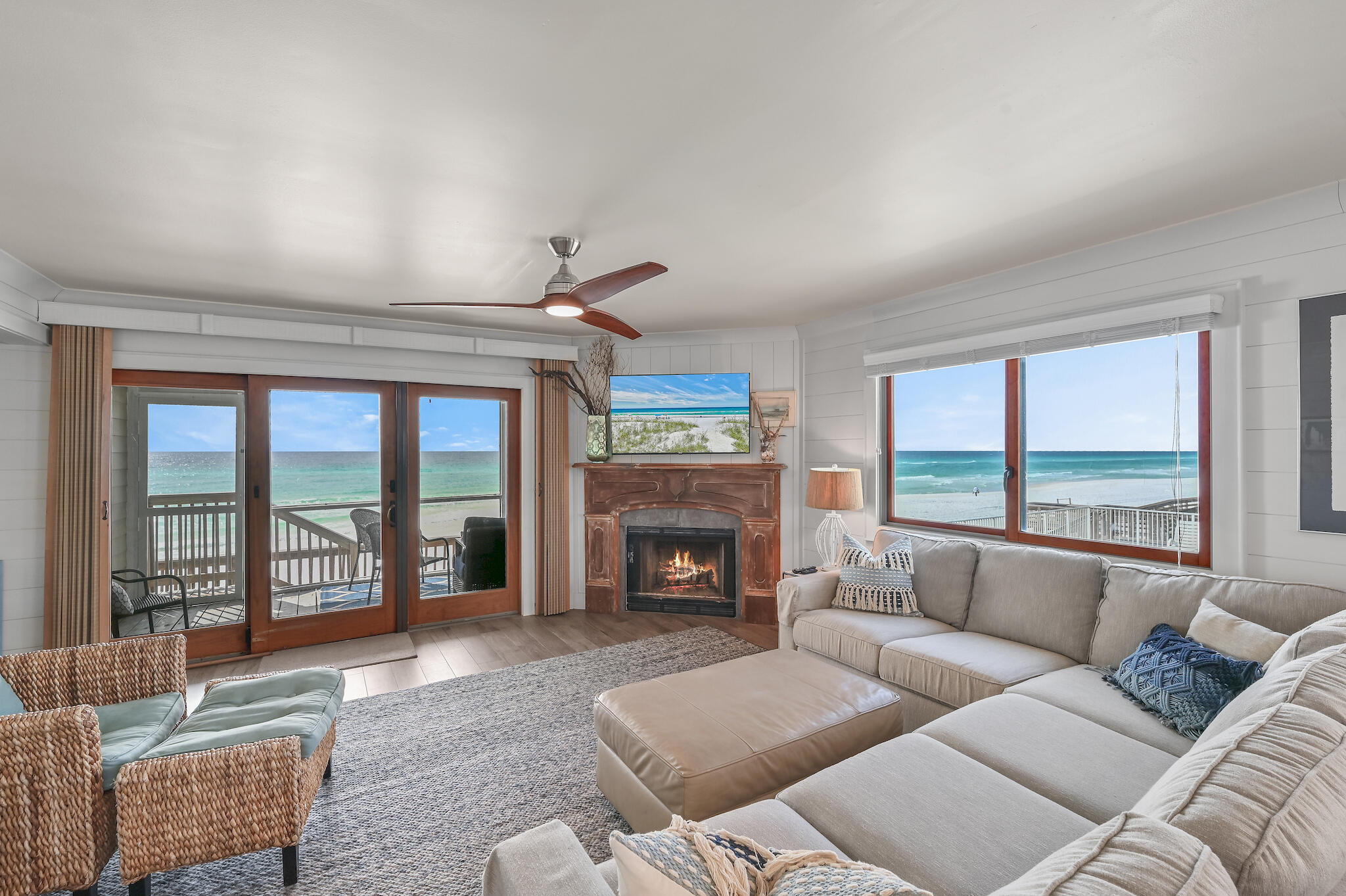 GULF FRONT with private beach and gulf front pool! You must see this fully renovated corner unit offering outstanding sunset views. On the first floor is an open concept, fully renovated kitchen with granite countertops, a large living area with fireplace, laundry, half bath, and a screen porch for enjoying the incredible south and west-facing views. Upstairs there are three bedrooms and two bathrooms. Wake up to the sights and sounds of the ocean in the gulf-front master bedroom with a full-width, private balcony just outside. The new bathroom includes a tile shower, double sinks, and granite countertops. Two guest bedrooms share an updated guest bathroom complete with tile floors and quartz countertops.
