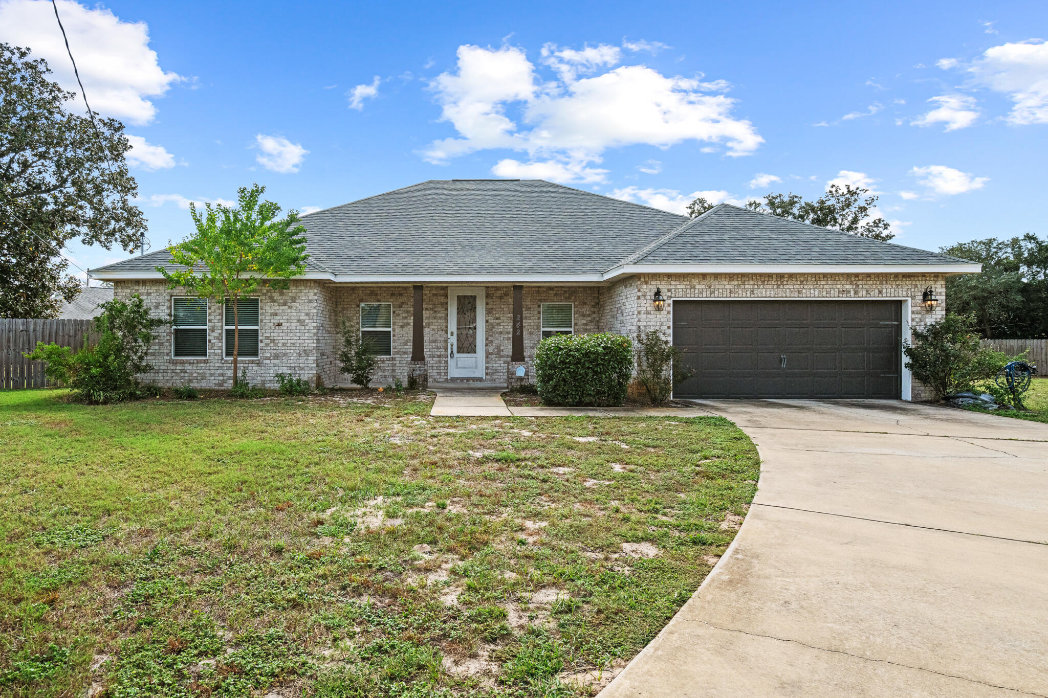 This gorgeous brick home is ready for you to call it home! It features 3 bedrooms and 2 bathrooms with an open concept living room with designated formal dining room space and plenty of room for you and your family to entertain and truly enjoy your home!The kitchen features bar seating, stainless steel appliances, granite countertops and tiled floors throughout. Out back enjoy your LARGE, private yard with a covered porch where you can sit and enjoy your morning coffee or the evening stars.