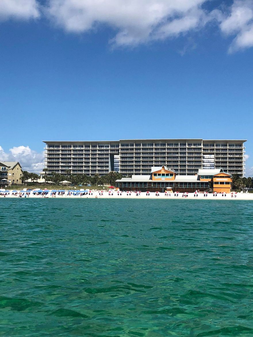 Looking for a retreat or short term rental in the heart of Destin with tropical gardens, fantastic amenities and a dreamy oasis pool? Then Unit 212 at Sterling Shores is ready for you! $22,700+ already booked for 2022! Enjoy the  lagoon-style pool set amidst lush tropical landscaping which also has a play area for kids of all ages.  For those who love the beach you will enjoy 400 feet of deeded private beach access which features a private gulf-side beach club with a 1,000 sq. ft. pool (heated seasonally), snack bar (open seasonally), restrooms, shower, lockers and beach access. Other amenities include on-site rental, fitness center and theater room. The condo is centered near many restaurants and plenty of stores for shopping.

Inside the condo you will enjoy a newly updated master bedroom with hall bath and tub/shower surround. The living room is bright and inviting with neutral paint and white kitchen cabinets. The kitchen appliances are all stainless steel, and the large island allows for a wonderful place to enjoy a meal. The couch is a pull out which accommodates 2 additional guests making this unit capable to house 4 people. The large balcony has room for a table and chairs along with a couple of lounging chairs. The full-size washer and dryer convey with the sale. The HVAC is 2011 and water heater is 2015.