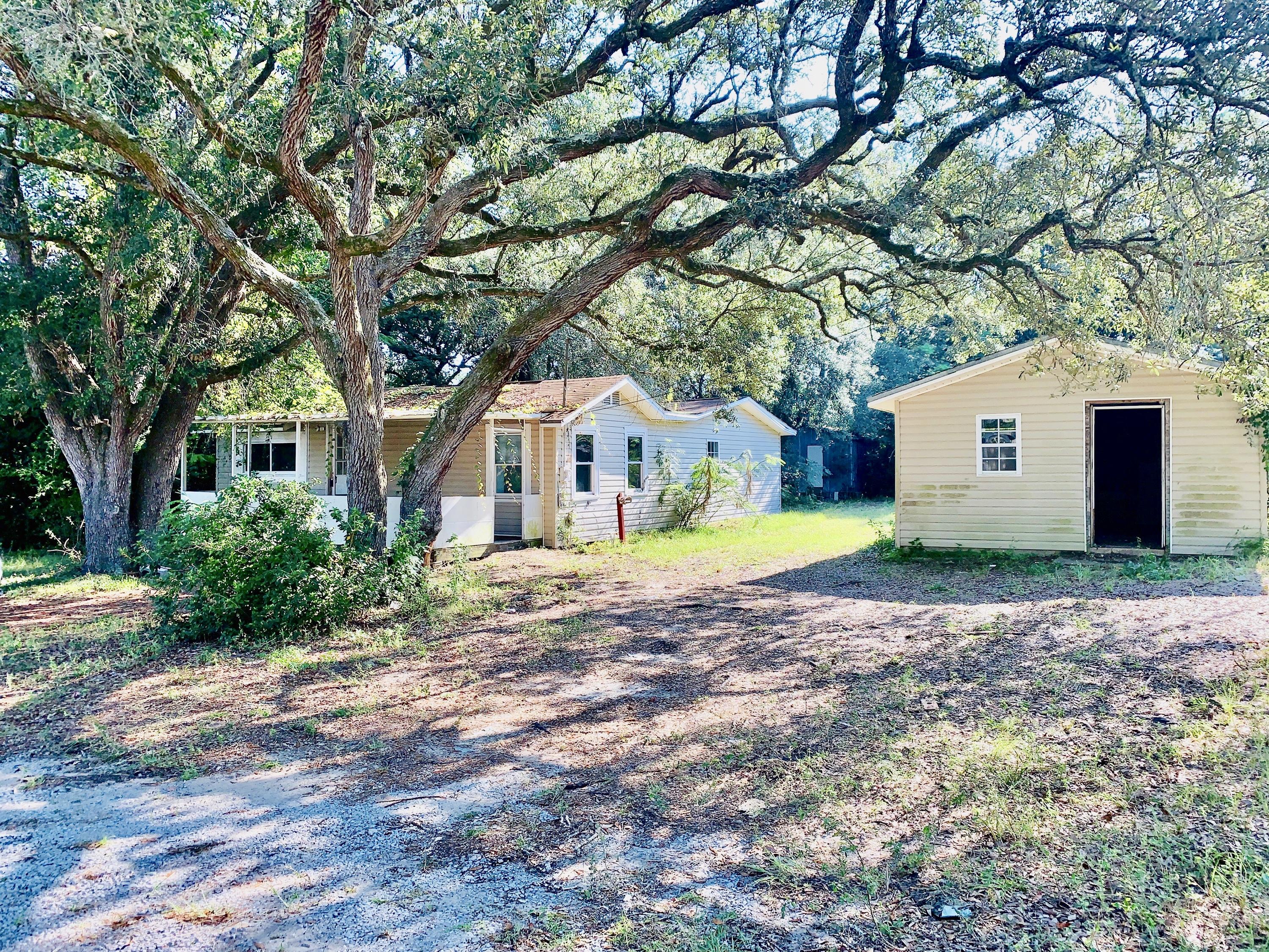 REO. Great Location! Original Florida Cottage with Front Porch large enough to fit your Rocking Chairs and sip some lemonade! 4 Bedrooms and 2 Full Baths in this cottage. Original HardWood flooring in some rooms Property has a large backyard with a spacious storage shed. Call for more information.