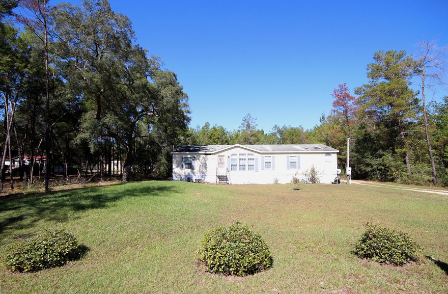 Private Country Setting! This manufactured home was built in 2005 and is in great condition and waiting for its new owners. Home features open floor plan with plenty of windows making this home light and bright. This home features split bedrooms that offers privacy that you might prefer. Kitchen has plenty of cabinets perfect for all of your cooking needs. Kitchen features breakfast bar, electric stove with exhaust fan, dishwasher, pantry, refrigerator and eat-in kitchen as well as a dining room. Dining room is adjacent to the living Room with vaulted ceiling. Master bath has double vanity, separate shower and garden tub. Home has a nice size utility room.