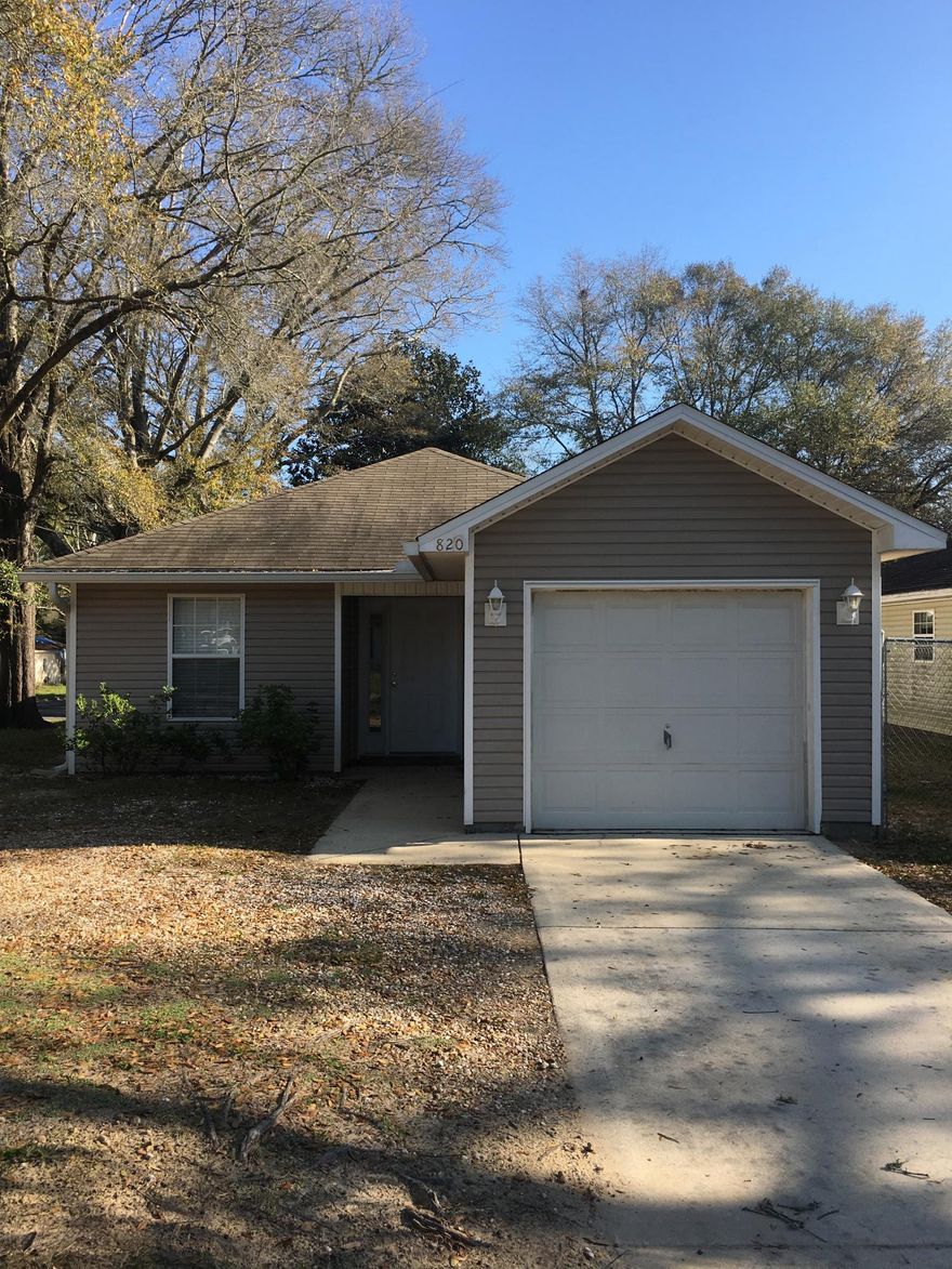 This 3 bedroom 2 bath home is in move in ready condition and was built in 2005. The home is 1,232 square feet of inside space with a 1 car attached garage making the entire home 1,560 square foot. This home is on a corner lot and has been well maintained. A closed alley at the end of the home allows access to this home and yard from 3 sides. The back yard is fenced with a wooden 6 foot tall privacy fence. The home is also blocks from Highway 85 and 90 for great access and within 5 miles of Interstate 10 and Walmart here in Crestview.The inside of the home offers a open floor plan with all of the 3 bedrooms on the west side of the home with a large open space for dining and entertainment. A open kitchen is attached to the open floor plan with tile flooring.