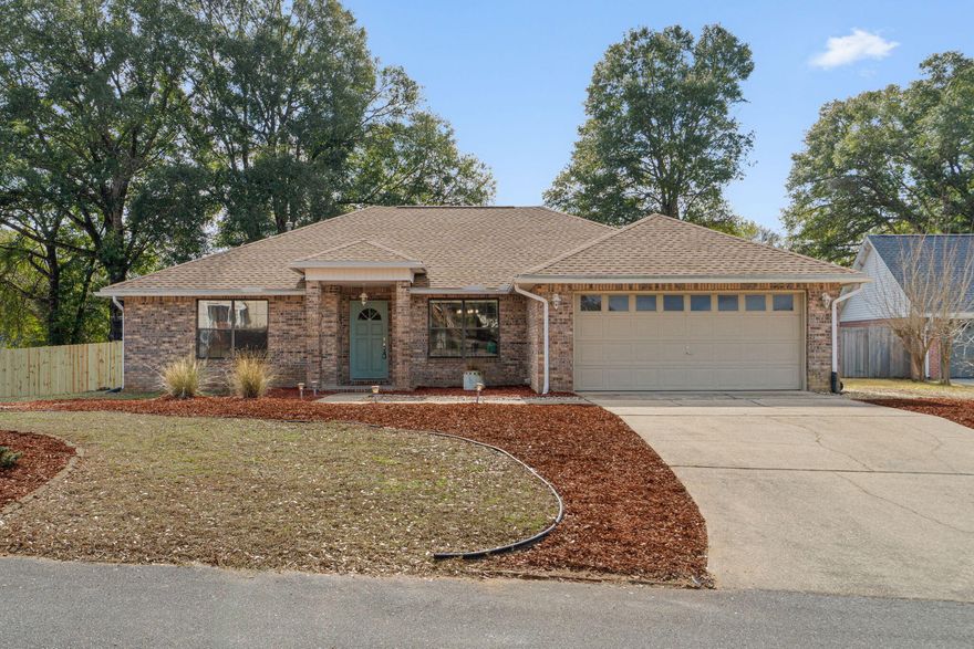 Welcome to this well-maintained 3BR/2BA brick home located in south Crestview, offering an easy commute to Eglin Air Force Base and Hurlburt Field - perfect for those tired of seeing the same cookie cutter house and seeking convenience without sacrificing space or serenity. Tucked away at the end of a quiet cul-de-sac, this home is one of only 10 homesites and backs to a peaceful neighborhood lake, where you enjoy fishing and outdoor play. Have peace of mind with a 30-year architectural shingle roof (installed late 2021). Inside, you'll find cathedral ceilings, luxury vinyl plank/tile flooring throughout (no carpet), designer lighting, a gas fireplace, and a formal dining room filled with natural light. The kitchen features granite countertops, solid oak cabinetry, a gas stove, coffee bar, and breakfast area overlooking the backyard.

The primary suite offers calming lake views, French doors, tray ceiling, and an ensuite bath with a garden tub and separate glass-enclosed shower. Two additional bedrooms are generously sized and share a well-appointed guest bath with a tiled shower and granite counters. 

Outdoor living shines with a large screened porch, open patio patio perfect for grilling, a storage shed, and paver paths leading to a 24' x 12' detached studio with electricity and water access - ideal for a home office, workout space, hobby room, or flex space!

Homes in South Crestview with this level of privacy, bonus space, and commute convenience are rare. Schedule your showing today and make this your next home! (washer, dryer, and living room tv will convey, living room furniture negotiable!)