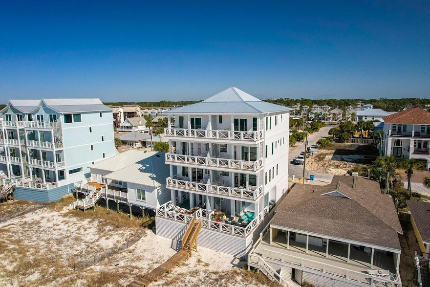 Featured on HGTV this stunning luxury beachfront home is located on the sugary white sands of the Gulf of Mexico in Panama City Beach. This newer constructed 5 bedroom, 5.5 bath duplex comes fully furnished and can sleep up to 19 guests making it an excellent investment property. As you enter the 1st level you will find a spacious bunk room with full bathroom in the hall. Stop by the wet bar to grab a cocktail on your way out to the private heated pool with direct beach access from the beach walkover. The second floor seamlessly blends living and dining areas creating the perfect space for entertaining. The gourmet kitchen features custom cabinetry, premium stainless-steel appliances, tile backsplash and beautiful quartz countertops.