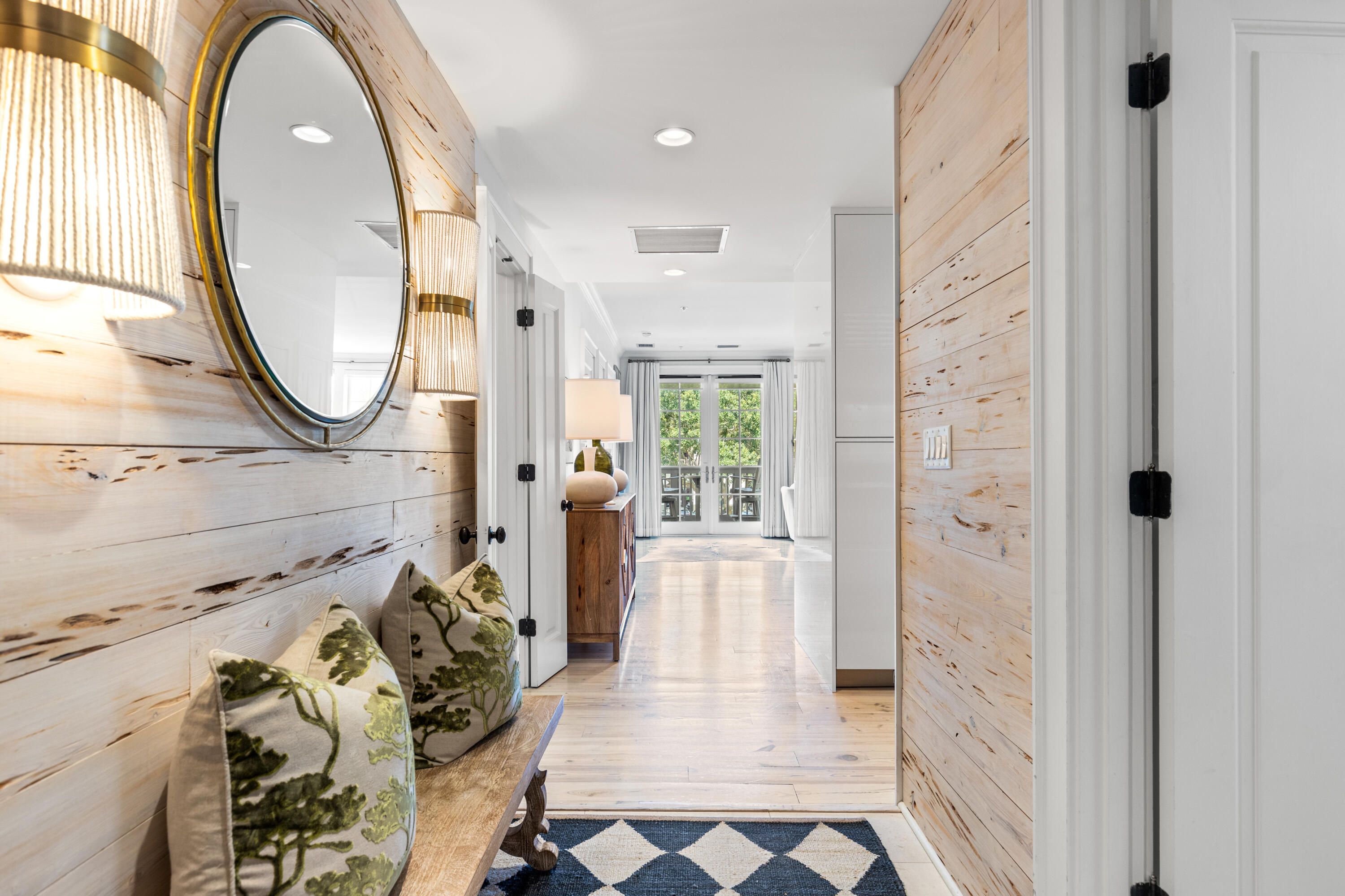 Sophisticated and serene, this beautifully appointed residence offers timeless design and a prime location in the heart of Rosemary Beach. Inside, whitewashed pecky cypress walls lead into a spacious open-concept living and dining area, anchored by a sleek Italian kitchen featuring top-of-the-line Wolf and Sub-Zero appliances. The floorplan is thoughtfully laid out, with each of the three bedrooms set in its own private wing--providing ideal separation for guests or family. Marble-accented bathrooms, custom built-ins, and warm hardwood floors add to the home's polished feel.From the balcony, enjoy views overlooking Barrett Square and the striking coastal architecture that defines the Town Center. Just a short stroll to world-class dining, shopping, and seasonal events, this residence offers the perfect blend of convenience and quiet retreat. An exceptional offering in one of 30A's most beloved communities.