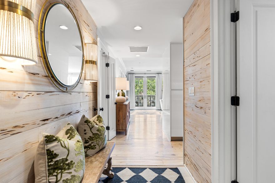 Sophisticated and serene, this beautifully appointed residence offers timeless design and a prime location in the heart of Rosemary Beach. Inside, whitewashed pecky cypress walls lead into a spacious open-concept living and dining area, anchored by a sleek Italian kitchen featuring top-of-the-line Wolf and Sub-Zero appliances. The floorplan is thoughtfully laid out, with each of the three bedrooms set in its own private wing--providing ideal separation for guests or family. Marble-accented bathrooms, custom built-ins, and warm hardwood floors add to the home's polished feel.From the balcony, enjoy views overlooking Barrett Square and the striking coastal architecture that defines the Town Center. Just a short stroll to world-class dining, shopping, and seasonal events, this residence offers the perfect blend of convenience and quiet retreat. An exceptional offering in one of 30A's most beloved communities.