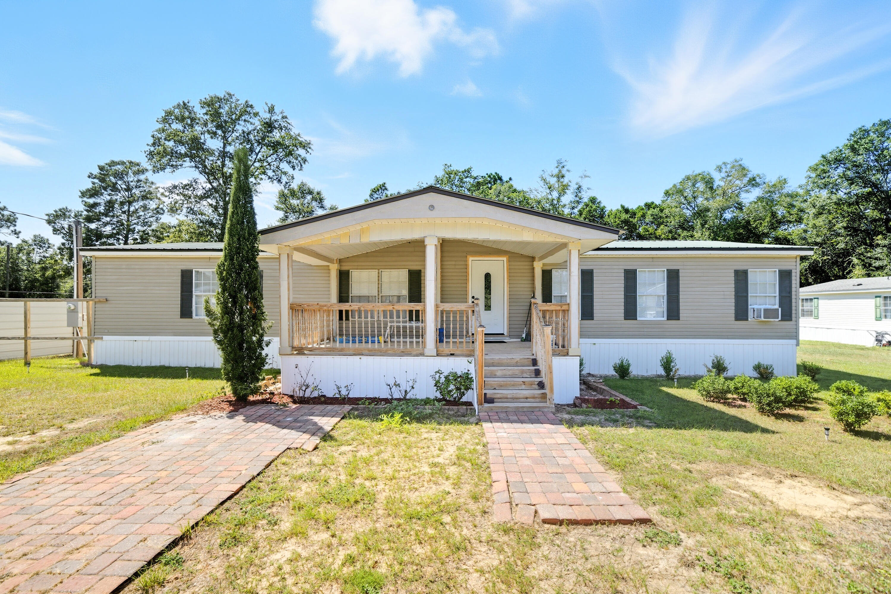 Charming 4-Bedroom Manufactured Home on Spacious Lot with Bonus Mobile Home. This property offers not only a spacious and stylish main residence but also includes an additional mobile home that conveys with the purchase, perfect for extended family, guests, or rental income potential.Step inside to discover a thoughtfully renovated interior featuring elegant ceiling designs and a chandelier that add a touch of luxuryA cozy wood-burning fireplace surrounded by classic brickwork, a modern kitchen with stainless steel appliances, granite countertops, wood cabinetry, and unique light fixtures, updated bathrooms with beautiful granite counters and contemporary fixtures. This property combines comfort, functionality, and investment potential in one unique package. Whether you're looking for a primary residence with room to grow or a dual-living opportunity, this home is a must-see!