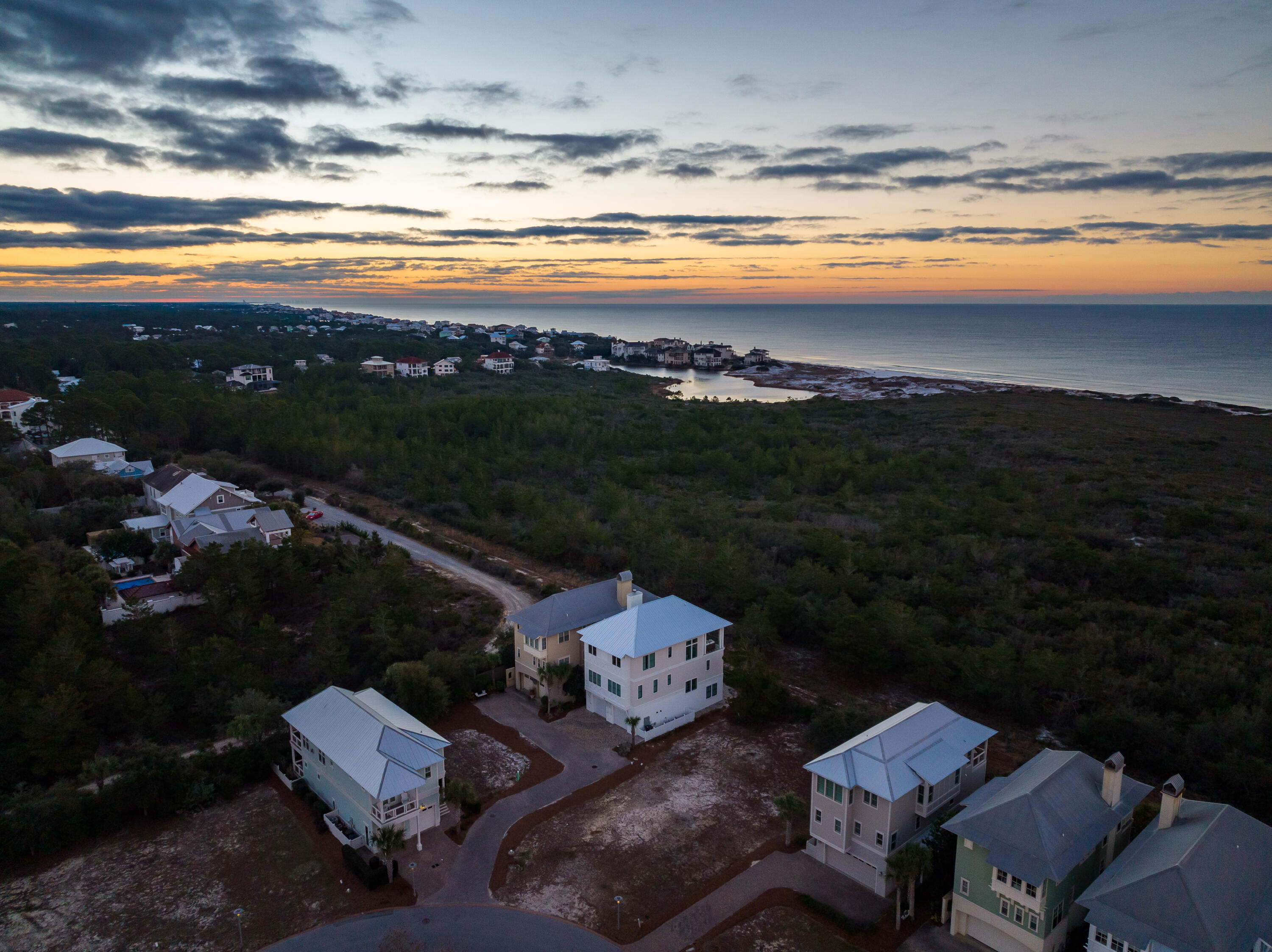 Make this Cypress Dunes front row home site overlooking The Gulf of Mexico and Topsail Hill Nature Preserve your new sanctuary! One of only few beach view lot left! The sunrise and sunset views from this home will be stunning with 180 degree views of the water. This lot is steps to the neighborhood's state of the art amenity center featuring an infinity edge pool overlooking the preserve/gulf, hot tub, 2nd level sun deck, outdoor covered fireplace, gym, and community owners lounge with commercial kitchen for parties. This lot is also located in a very quiet section of the neighborhood across the street from the very serene, natural cypress stand which will not be developed. It is also steps away from the tennis/pickle ball courts. 3-story house plans available upon request The west end of 30a is minutes from shopping, restaurants, entertainment. The gated Cypress Dunes neighborhood consists of 44 acres of native plants, 200 year old Cypress Head, surrounded by coastal dune lake and 3.2 miles of secluded beach and nature trails in Topsail Hill State Preserve