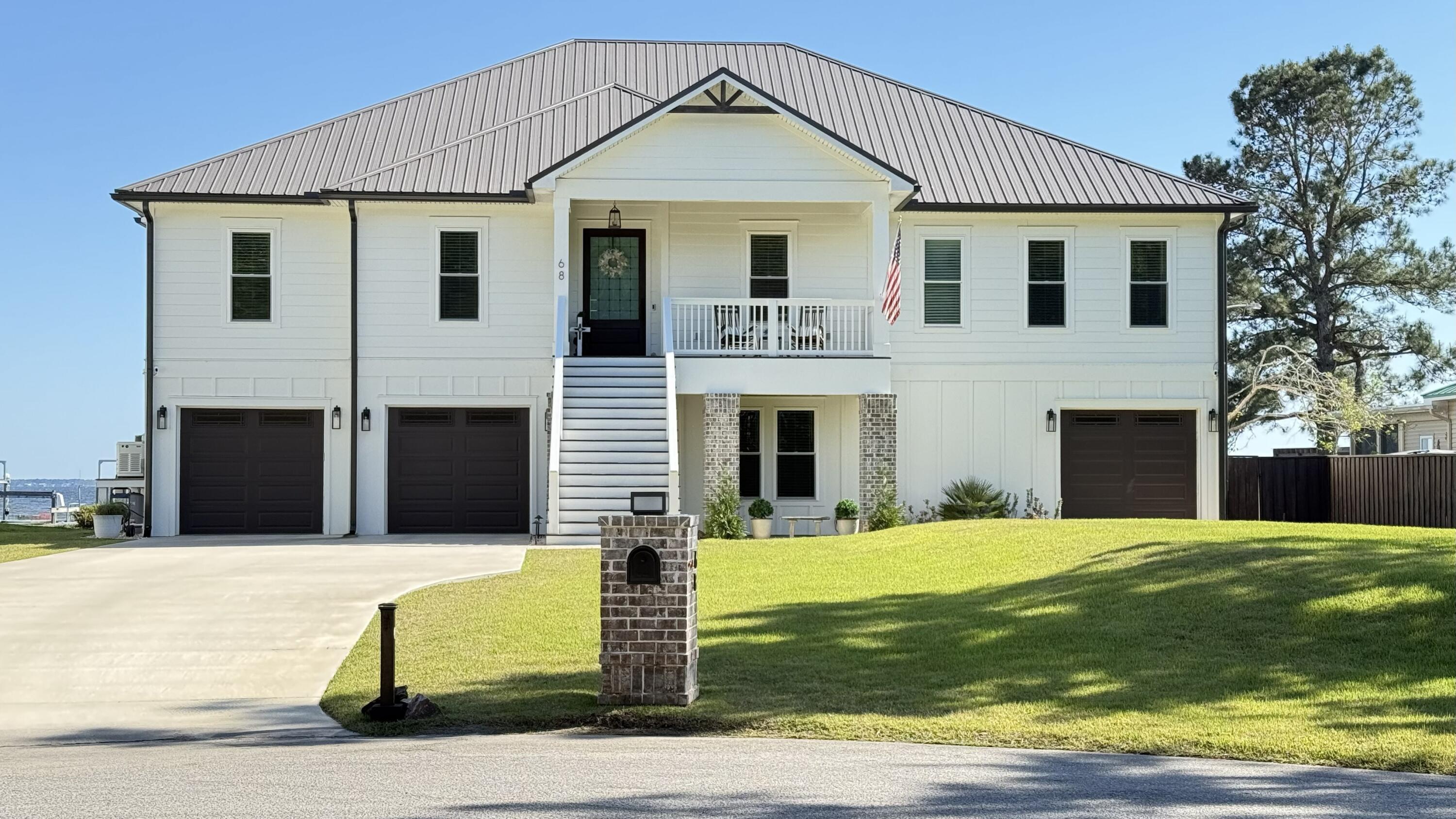 Beautiful Custom built, south facing Choctawhatchee Bay home. Enjoy beautiful sunrises, sunsets, fishing & dolphin viewings or dock your boat & enjoy your private 90' beach. Elevated one floor living with residential elevator and staircase. Massive Mahogany front door invites you into an open concept plan with breathtaking view of the Bay. Large screened porch to enjoy outdoor living.  Relax with the 60'' dimplex electric FP with custom surround while enjoying the view from the living area. Beautiful bright kitchen with quartz countertops, 10' island, stainless appliances, 36'' gas cooktop, custom hood, built-in oven/MW, beverage refrigerator, ice maker & pantry.  Master suite with great view & has bath with large shower + soaking tub, his & her vanities & WI closets. Laundry adjacent. 4 bedroom, 2 1/2 bath home plus Large mudroom that could be used as a gym or bedroom. Beautiful office just off of the foyer.  Luxury Vinyl Plank flooring throughout, large cusotm 7' high doors and windows for your viewing pleasure. Custom trim, lighting and ceiling fans. Elevator makes house handicap accessible.  Nice Covered front porch for guest.
No HOA on a quite cul de sac. Huge Garage built under home with 3 garage doors, electric openers, 10' ceiling and lots of storage or workshop space and bonus bath.  Ground level outdoor covered patio and shower for your aditional enjoyment. Abundant parking inside & out with bonus 50 AMP RV plug.  Custom built home offers Generac generator, metal roof, spray foam insulation, upgraded hurricane windows & doors, whole house gutter system, Whole house Culligan water softener with reverse osmosis, Tankless Water heater with circulating pump, two propane tanks. Partial privacy fence and rear fenced yard. Beautifully landscaped with well for lawn irrigation. 1000 SF Dock has been approved and permitted for future Construction.